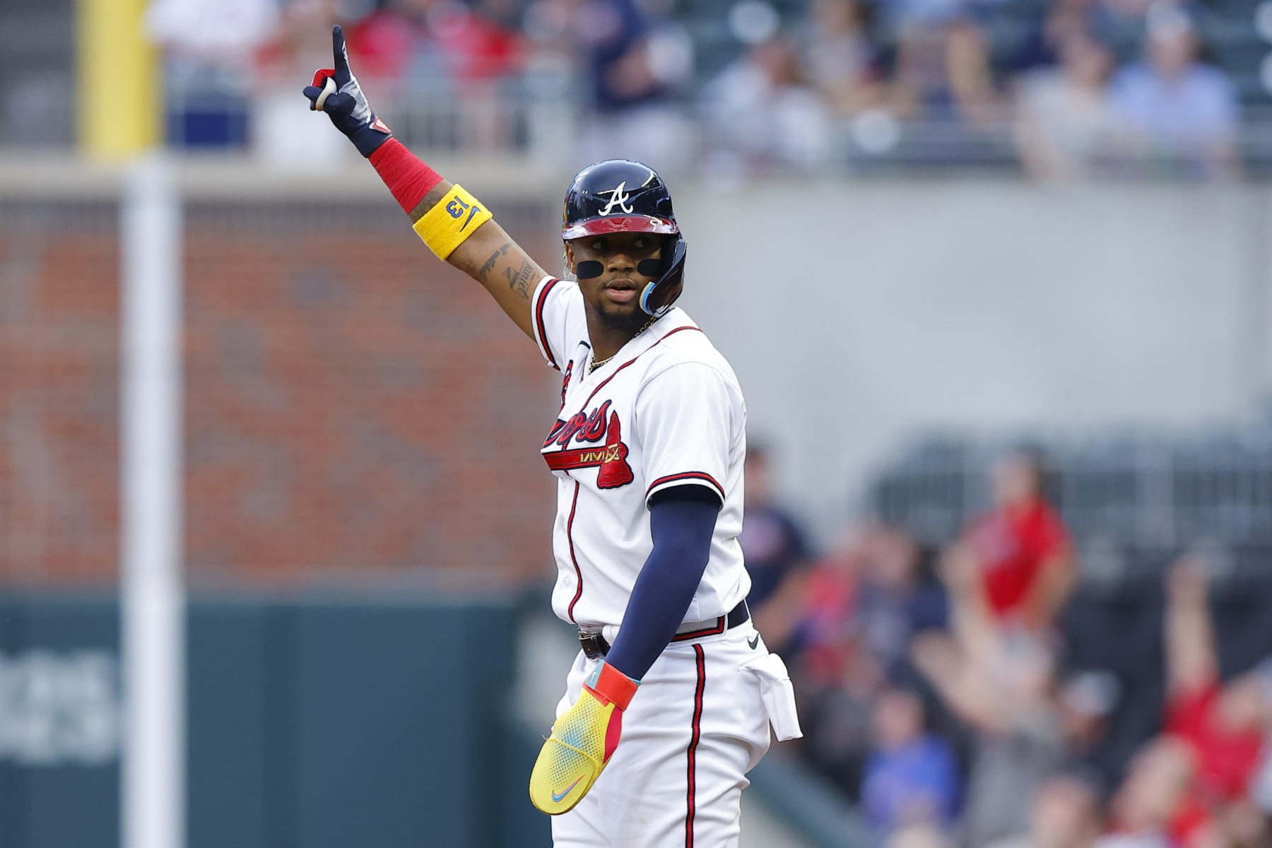 ATLANTA, GA - MAY 09: Ronald Acuna Jr. #13 of the Atlanta Braves reacts after Matt Olson's home run during the first inning against the Boston Red Sox at Truist Park on May 9, 2023 in Atlanta, Georgia. (Photo by Todd Kirkland/Getty Images)