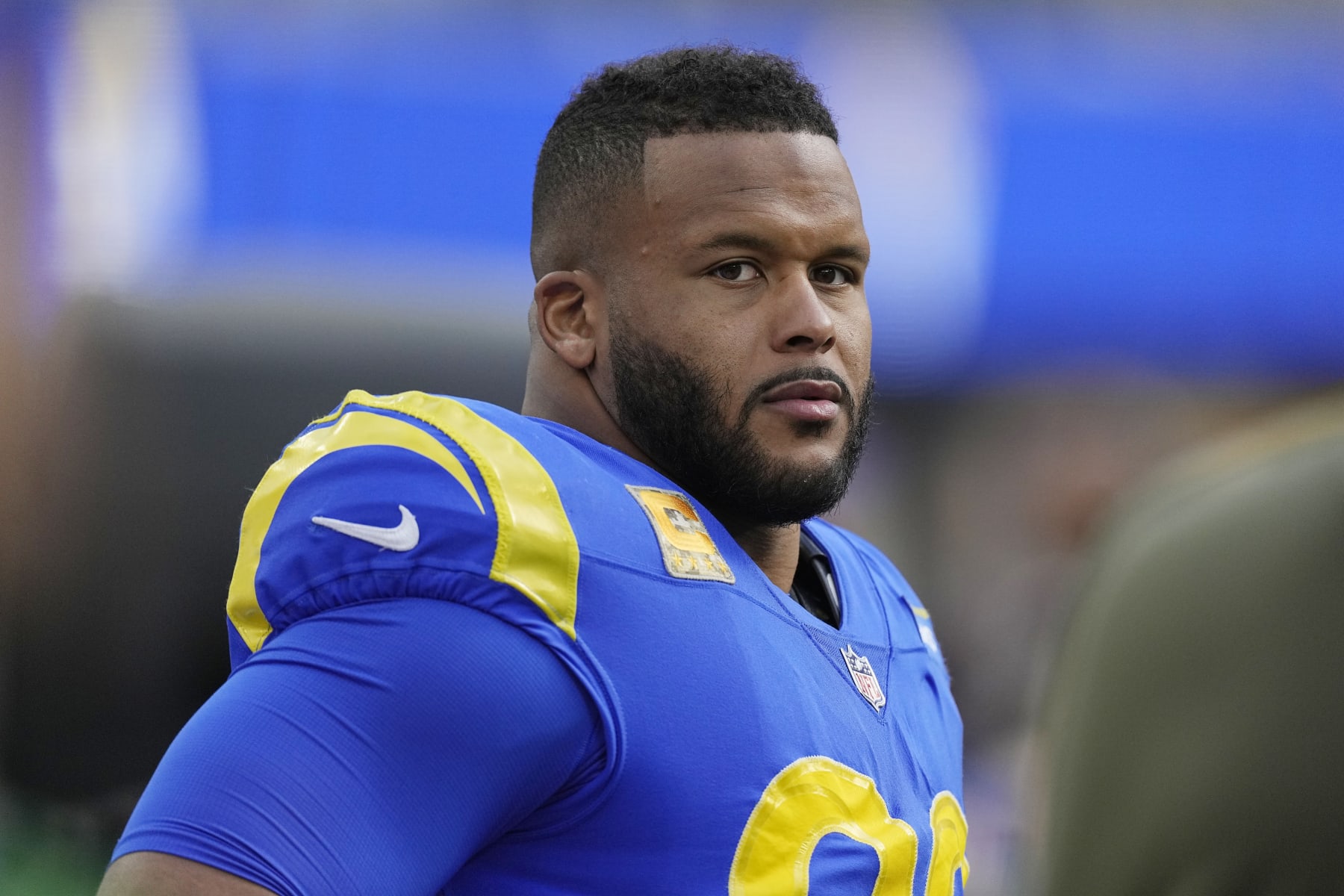 Los Angeles Rams defensive tackle Aaron Donald looks on from the bench during the first half of an NFL football game against the Arizona Cardinals Sunday, Nov. 13, 2022, in Inglewood, Calif. (AP Photo/Mark J. Terrill)