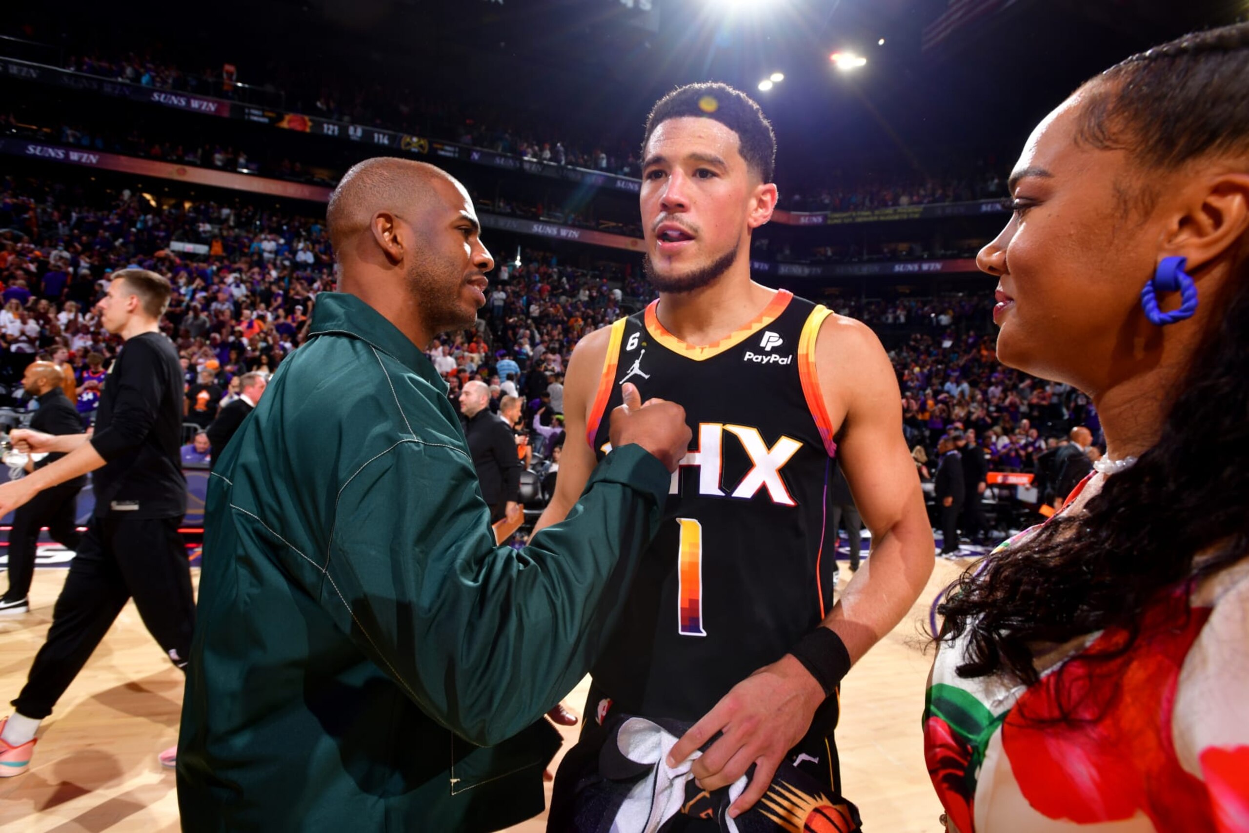PHOENIX, AZ - MAY 5: Chris Paul #3 of the Phoenix Suns congratulates Devin Booker #1 after Game 3 of the 2023 NBA Playoffs Western Conference Semi-Finals against the Denver Nuggets on May 5, 2023 at Footprint Center in Phoenix, Arizona. NOTE TO USER: User expressly acknowledges and agrees that, by downloading and or using this photograph, user is consenting to the terms and conditions of the Getty Images License Agreement. Mandatory Copyright Notice: Copyright 2023 NBAE (Photo by Barry Gossage/NBAE via Getty Images)