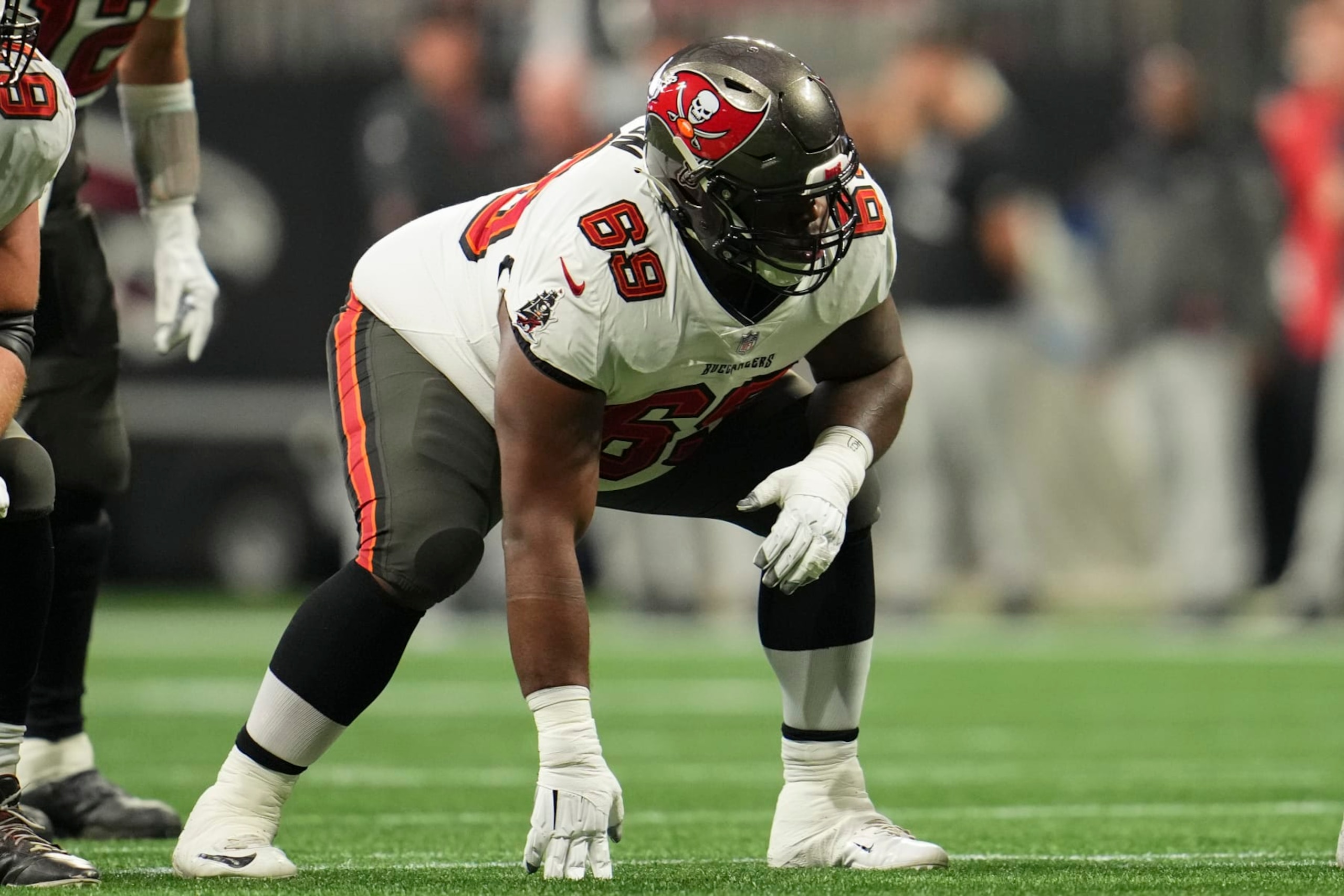 ATLANTA, GA - JANUARY 08: Shaq Mason #69 of the Tampa Bay Buccaneers gets set against the Atlanta Falcons at Mercedes-Benz Stadium on January 8, 2023 in Atlanta, Georgia. (Photo by Cooper Neill/Getty Images) ATLANTA, GA - JANUARY 08: Shaq Mason #69 of the Tampa Bay Buccaneers gets set against the Atlanta Falcons at Mercedes-Benz Stadium on January 8, 2023 in Atlanta, Georgia. (Photo by Cooper Neill/Getty Images)