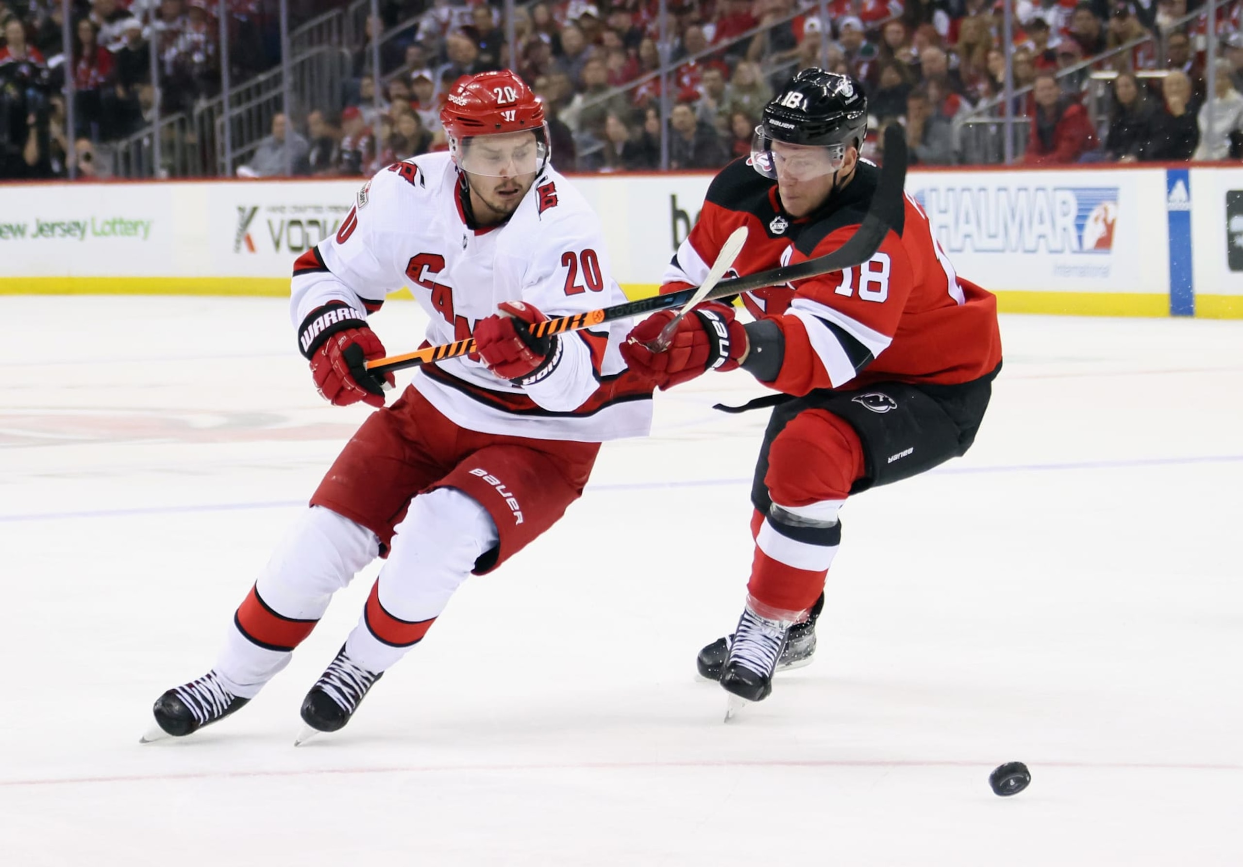 NEWARK, NEW JERSEY - MAY 09: Sebastian Aho #20 of the Carolina Hurricanes skates around Ondrej Palat #18 of the New Jersey Devils in Game Four of the Second Round of the 2023 Stanley Cup Playoffs at Prudential Center on May 09, 2023 in Newark, New Jersey. (Photo by Bruce Bennett/Getty Images)