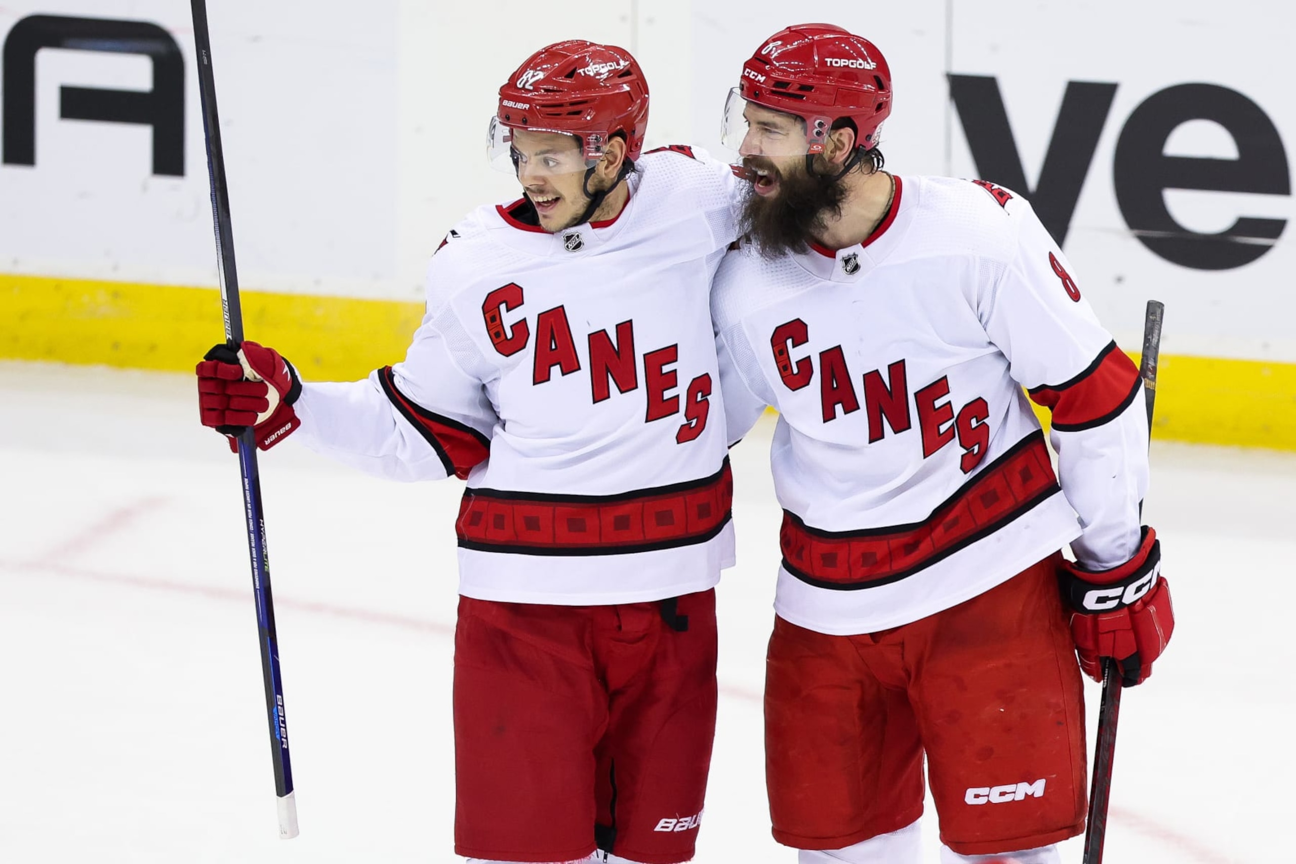 NEWARK, NJ - MAY 09: Carolina Hurricanes defenseman Brent Burns (8) celebrates with Carolina Hurricanes center Jesperi Kotkaniemi (82) after scoring a goal during Game 4 of an Eastern Conference Second Round playoff game between the Carolina Hurricanes and the New Jersey Devils on May 9, 2023, at Prudential Center in Newark, New Jersey. (Photo by Andrew Mordzynski/Icon Sportswire via Getty Images)