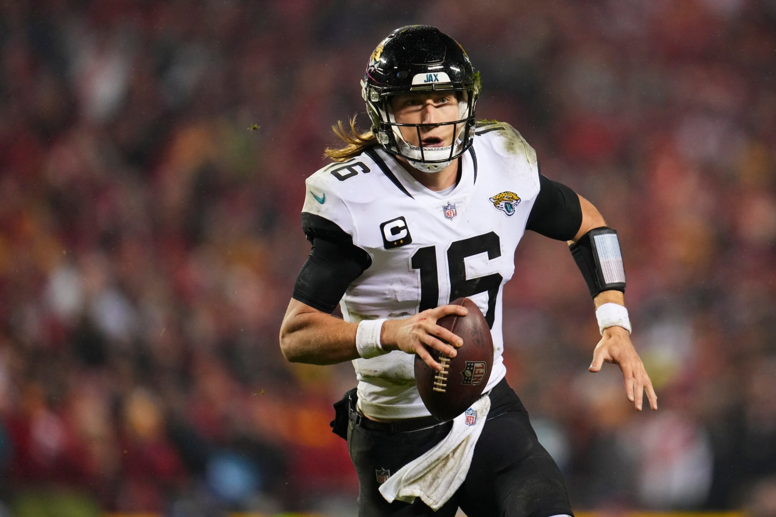 KANSAS CITY, MO - JANUARY 21: Trevor Lawrence #16 of the Jacksonville Jaguars scrambles against the Kansas City Chiefs at GEHA Field at Arrowhead Stadium on January 21, 2023 in Kansas City, Missouri. (Photo by Cooper Neill/Getty Images)
