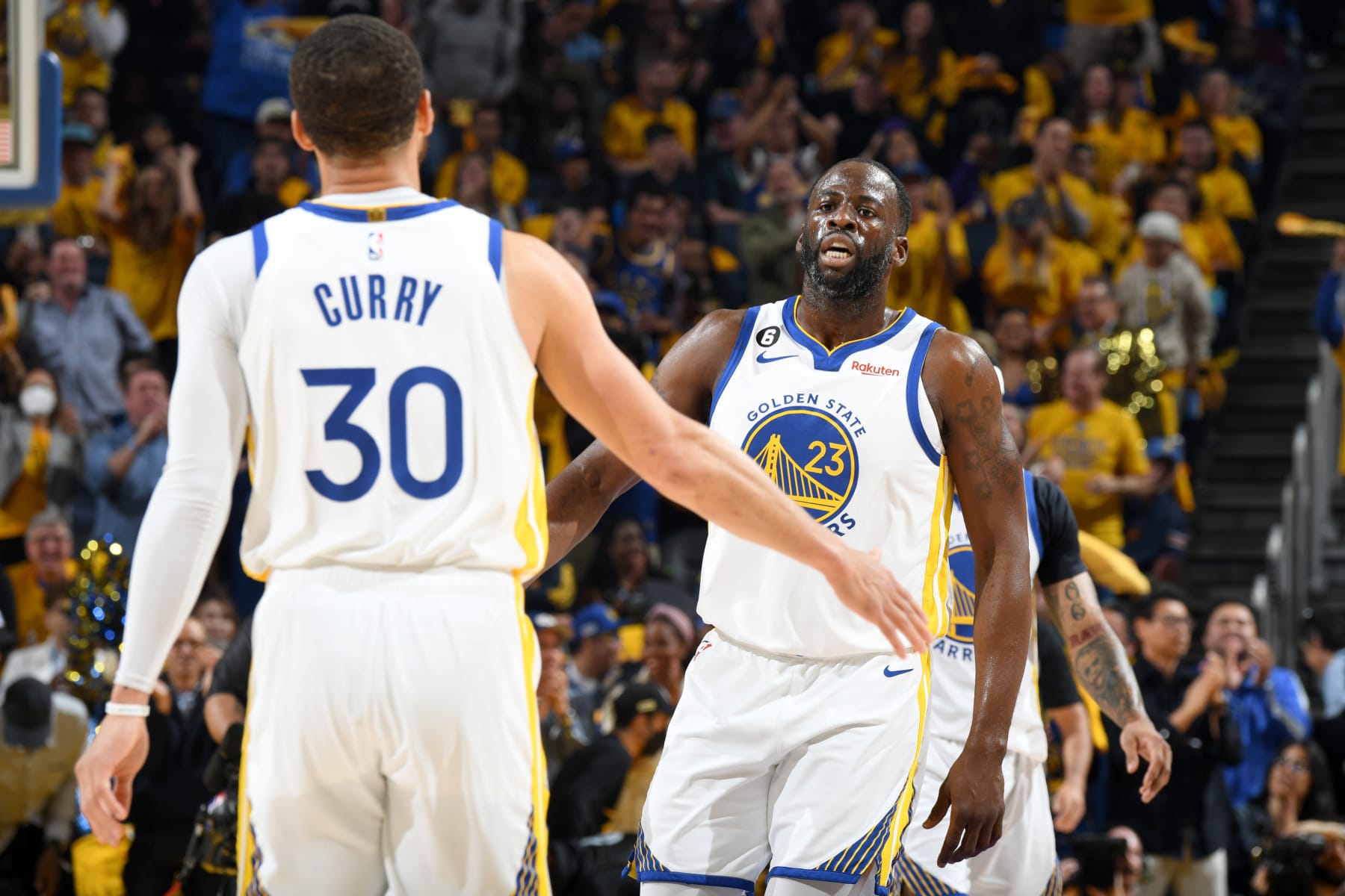 SAN FRANCISCO, CA - MAY 10:  Stephen Curry #30 and Draymond Green #23 of the Golden State Warriors high five during Game 5 of the Western Conference Semi-Finals of the 2023 NBA Playoffs against the Los Angeles Lakers on May 10, 2023 at Chase Center in San Francisco, California. NOTE TO USER: User expressly acknowledges and agrees that, by downloading and or using this photograph, user is consenting to the terms and conditions of Getty Images License Agreement. Mandatory Copyright Notice: Copyright 2023 NBAE (Photo by Andrew D. Bernstein/NBAE via Getty Images)