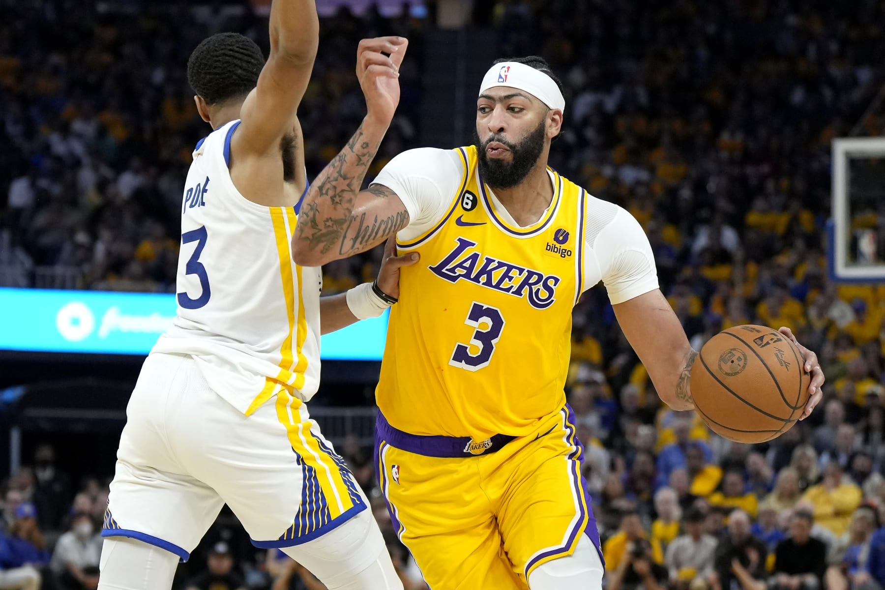 SAN FRANCISCO, CALIFORNIA - MAY 10: Anthony Davis #3 of the Los Angeles Lakers drives past Jordan Poole #3 of the Golden State Warriors during the second quarter in game five of the Western Conference Semifinal Playoffs at Chase Center on May 10, 2023 in San Francisco, California. NOTE TO USER: User expressly acknowledges and agrees that, by downloading and or using this photograph, User is consenting to the terms and conditions of the Getty Images License Agreement. (Photo by Thearon W. Henderson/Getty Images)