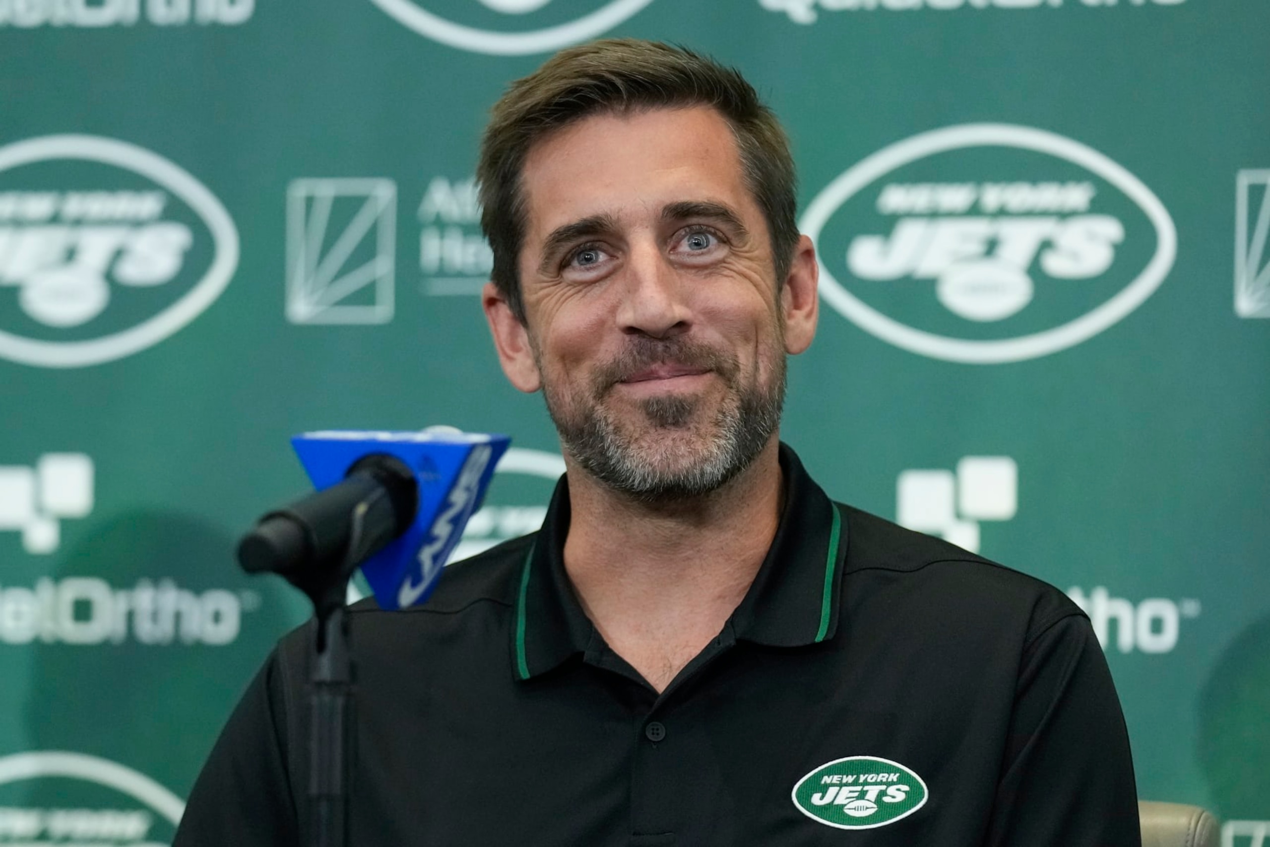 New York Jets' quarterback Aaron Rodgers smiles during an NFL football news conference at the Jets' training facility in Florham Park, N.J., Wednesday, April 26, 2023. (AP Photo/Seth Wenig)
