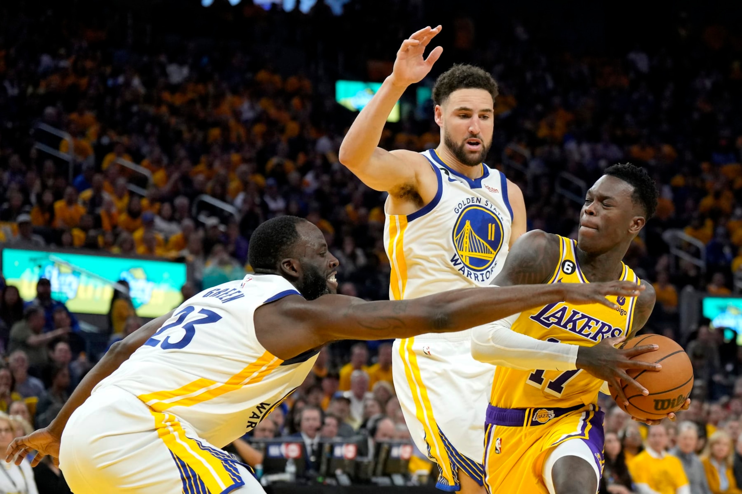 SAN FRANCISCO, CALIFORNIA - MAY 10: Dennis Schroder #17 of the Los Angeles Lakers drives to the basket against Draymond Green #23 and Klay Thompson #11 of the Golden State Warriors during the second quarter in game five of the Western Conference Semifinal Playoffs at Chase Center on May 10, 2023 in San Francisco, California. NOTE TO USER: User expressly acknowledges and agrees that, by downloading and or using this photograph, User is consenting to the terms and conditions of the Getty Images License Agreement. (Photo by Thearon W. Henderson/Getty Images) SAN FRANCISCO, CALIFORNIA - MAY 10: Dennis Schroder #17 of the Los Angeles Lakers drives to the basket against Draymond Green #23 and Klay Thompson #11 of the Golden State Warriors during the second quarter in game five of the Western Conference Semifinal Playoffs at Chase Center on May 10, 2023 in San Francisco, California. NOTE TO USER: User expressly acknowledges and agrees that, by downloading and or using this photograph, User is consenting to the terms and conditions of the Getty Images License Agreement. (Photo by Thearon W. Henderson/Getty Images)