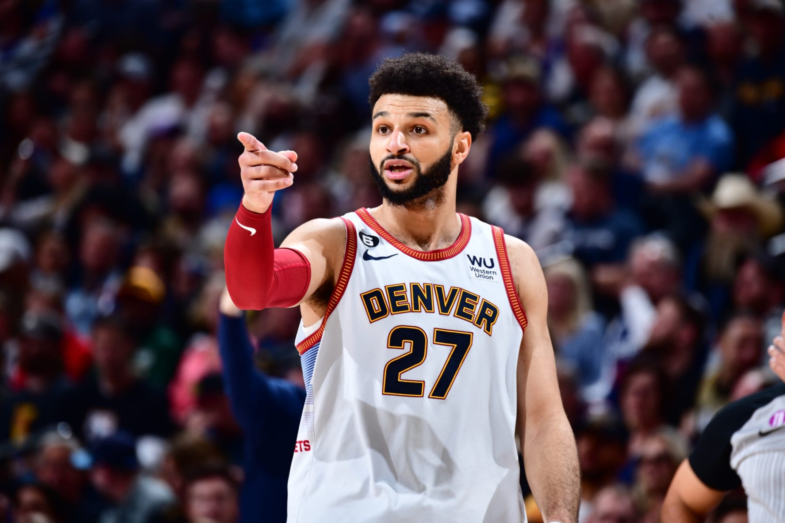 DENVER, CO - MAY 9: Jamal Murray #27 of the Denver Nuggets sets the play during Game Five of the Western Conference Semi-Finals of the 2023 NBA Playoffs against the Phoenix Suns on May 9, 2023 at the Ball Arena in Denver, Colorado. NOTE TO USER: User expressly acknowledges and agrees that, by downloading and/or using this Photograph, user is consenting to the terms and conditions of the Getty Images License Agreement. Mandatory Copyright Notice: Copyright 2023 NBAE (Photo by Barry Gossage/NBAE via Getty Images)