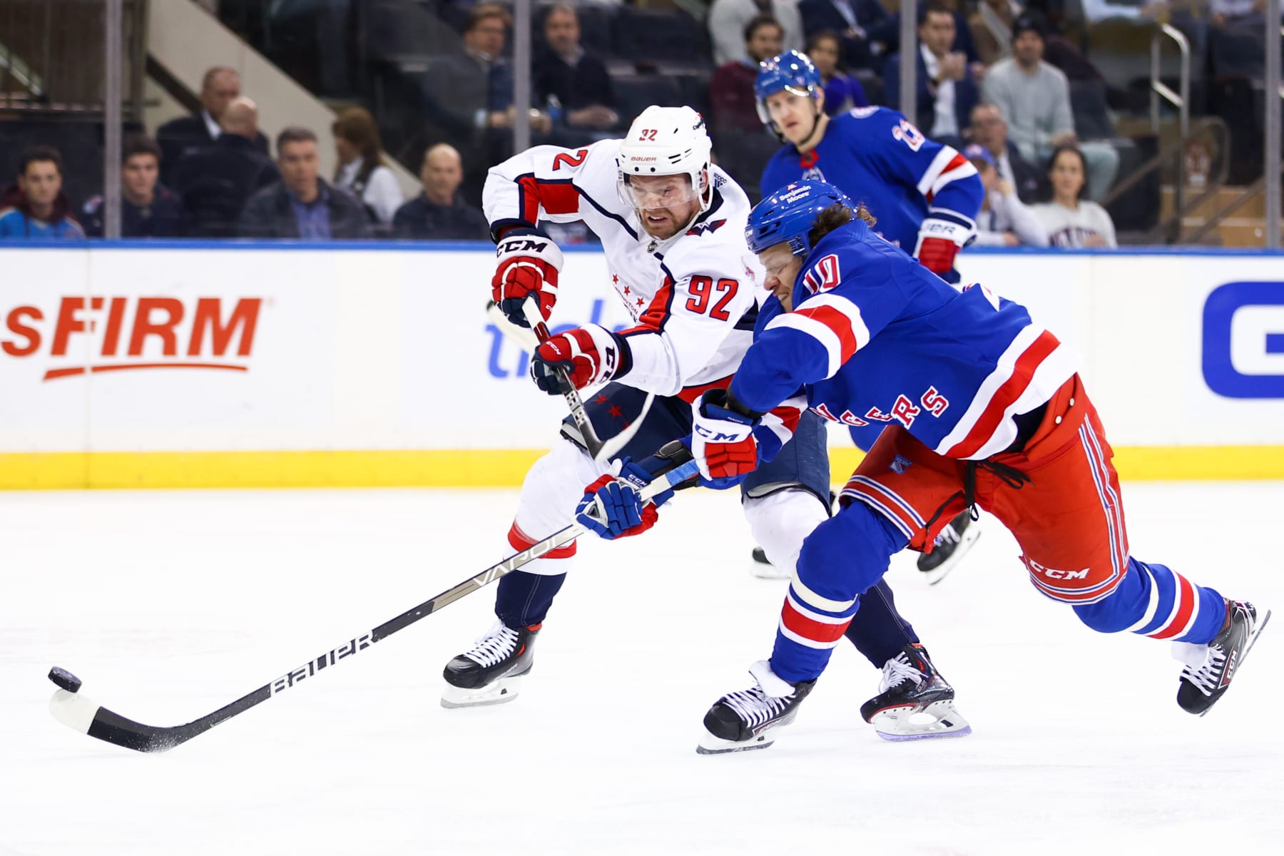 NEW YORK, NY - FEBRUARY 24: New York Rangers Left Wing Artemi Panarin (10) beats Washington Capitals Center Evgeny Kuznetsov (92) to the puck in the Rangers zone during the third period of the National Hockey League game between the Washington Capitals and the New York Rangers on February 24, 2022 at Madison Square Garden in New York, NY. (Photo by Joshua Sarner/Icon Sportswire via Getty Images)
