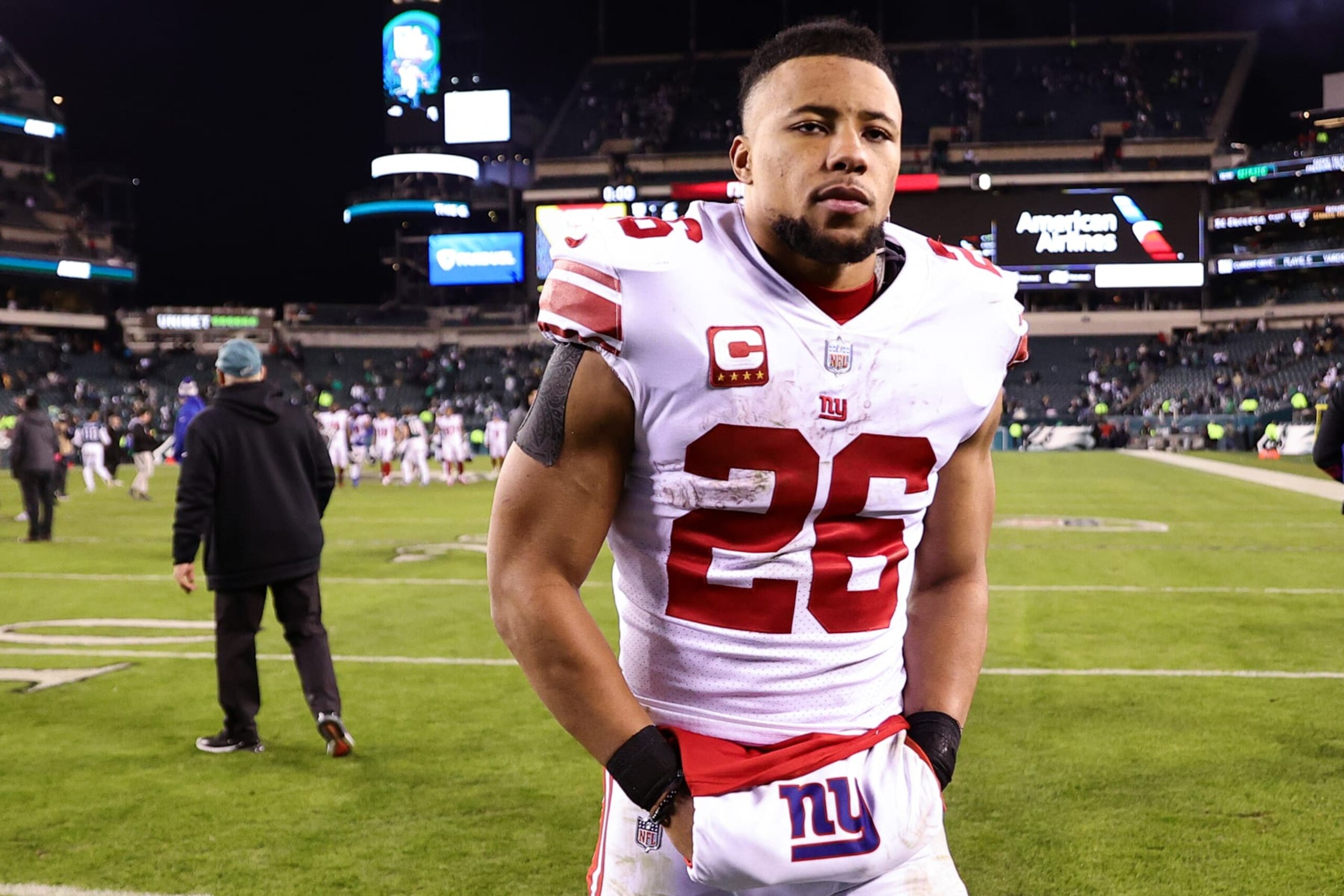 PHILADELPHIA, PENNSYLVANIA - JANUARY 21: Saquon Barkley #26 of the New York Giants walks off the field after losing to the Philadelphia Eagles 38-7 in the NFC Divisional Playoff game at Lincoln Financial Field on January 21, 2023 in Philadelphia, Pennsylvania. (Photo by Tim Nwachukwu/Getty Images) PHILADELPHIA, PENNSYLVANIA - JANUARY 21: Saquon Barkley #26 of the New York Giants walks off the field after losing to the Philadelphia Eagles 38-7 in the NFC Divisional Playoff game at Lincoln Financial Field on January 21, 2023 in Philadelphia, Pennsylvania. (Photo by Tim Nwachukwu/Getty Images)