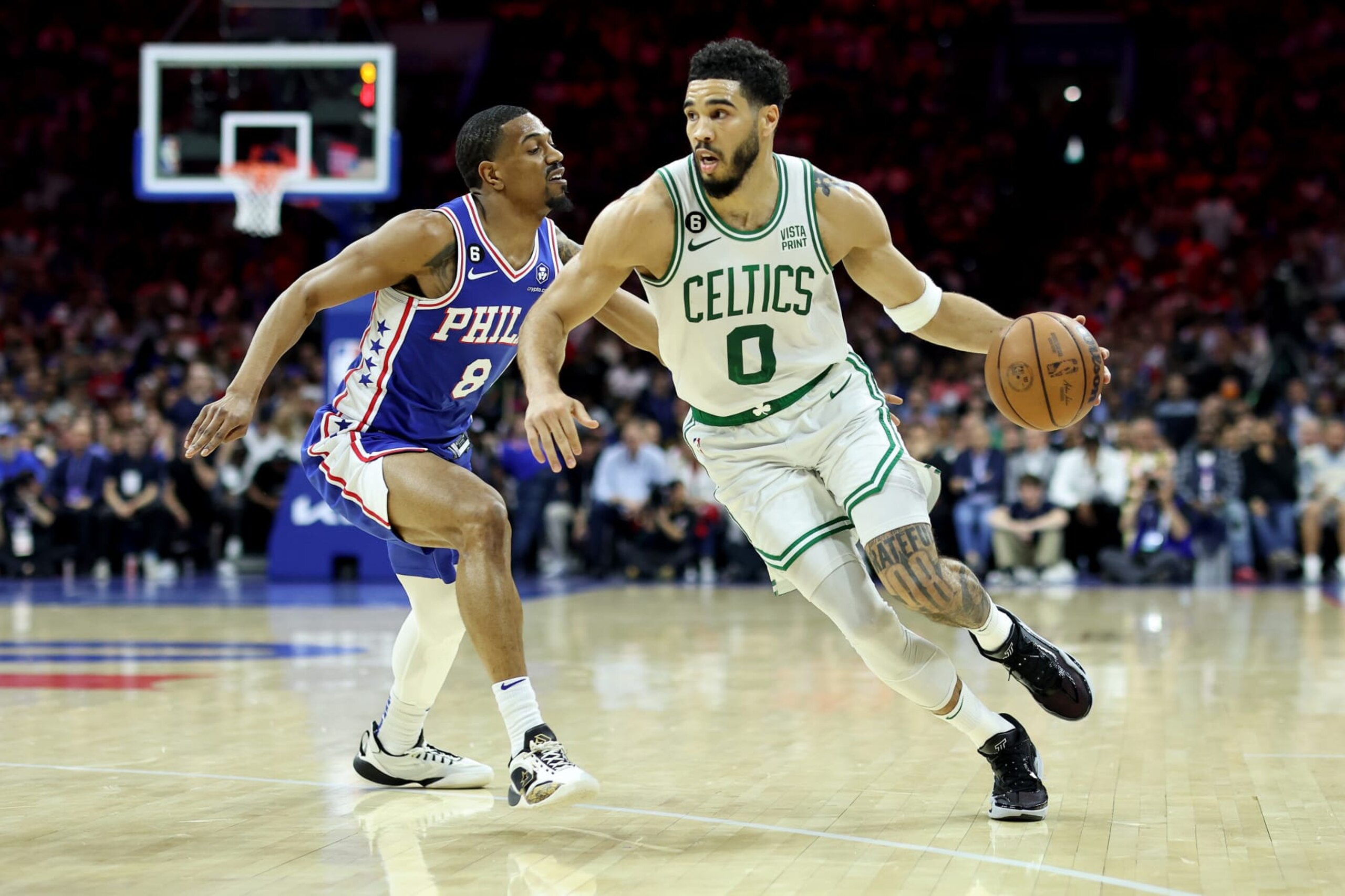 PHILADELPHIA, PENNSYLVANIA - MAY 11: Jayson Tatum #0 of the Boston Celtics drives to the basket against De'Anthony Melton #8 of the Philadelphia 76ers during the second quarter in game six of the Eastern Conference Semifinals in the 2023 NBA Playoffs at Wells Fargo Center on May 11, 2023 in Philadelphia, Pennsylvania. NOTE TO USER: User expressly acknowledges and agrees that, by downloading and or using this photograph, User is consenting to the terms and conditions of the Getty Images License Agreement. (Photo by Tim Nwachukwu/Getty Images)