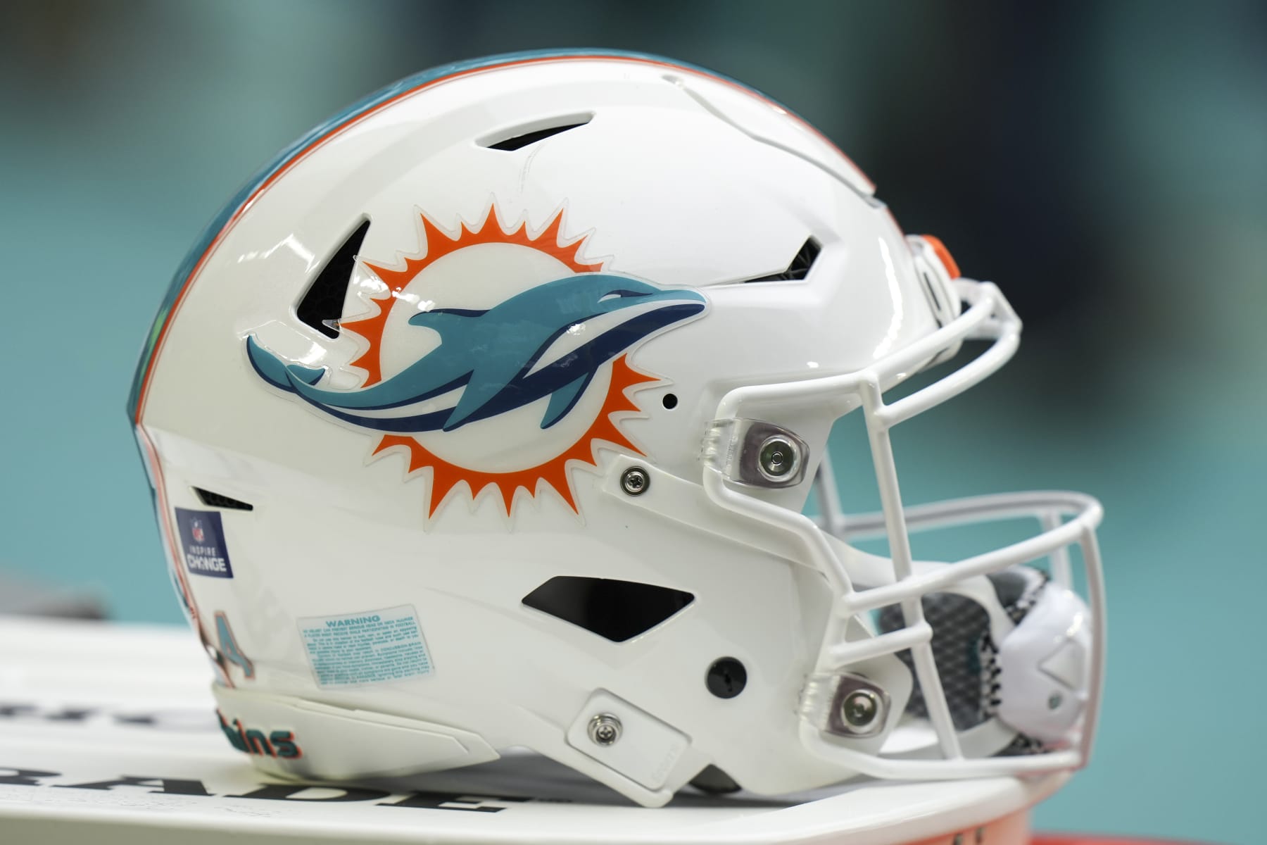 MIAMI GARDENS, FL - DECEMBER 25: a Miami Dolphins helmet rests near the sidelines during the game between the Green Bay Packers and the Miami Dolphins on Sunday, December 25, 2022 at Hard Rock Stadium, Miami Gardens, Fla. (Photo by Peter Joneleit/Icon Sportswire via Getty Images)