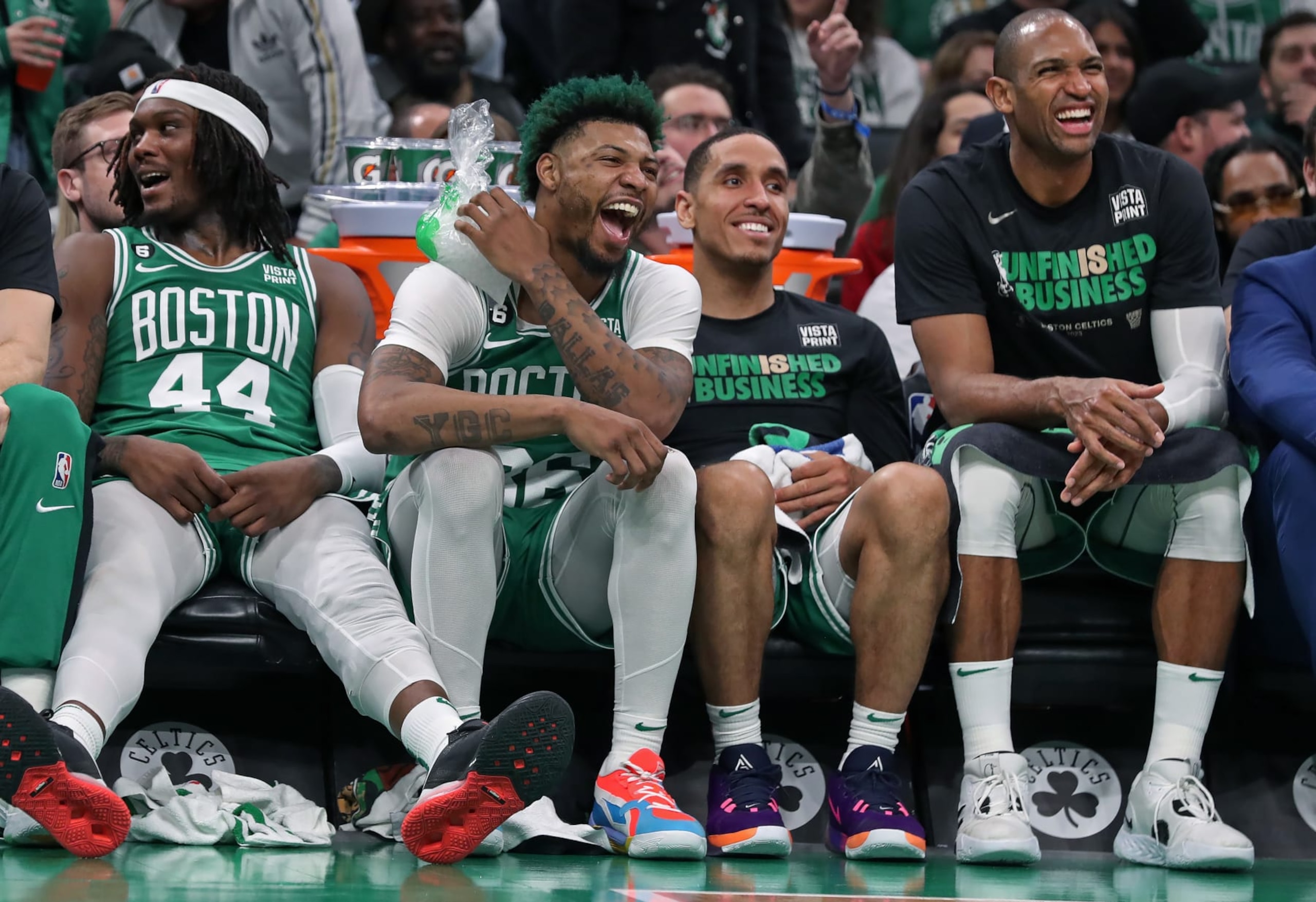 Boston, MA - May 3: From left, Boston Celtics Robert Williams III, Marcus Smart, Malcom Brogdon and Al Horford rest up during the closing minutes of the blowout win. The Celtics beat the Philadelphia 76ers, 121-87, in Game 2 of the 2023 Eastern Conference Semifinals. (Photo by Jim Davis/The Boston Globe via Getty Images)