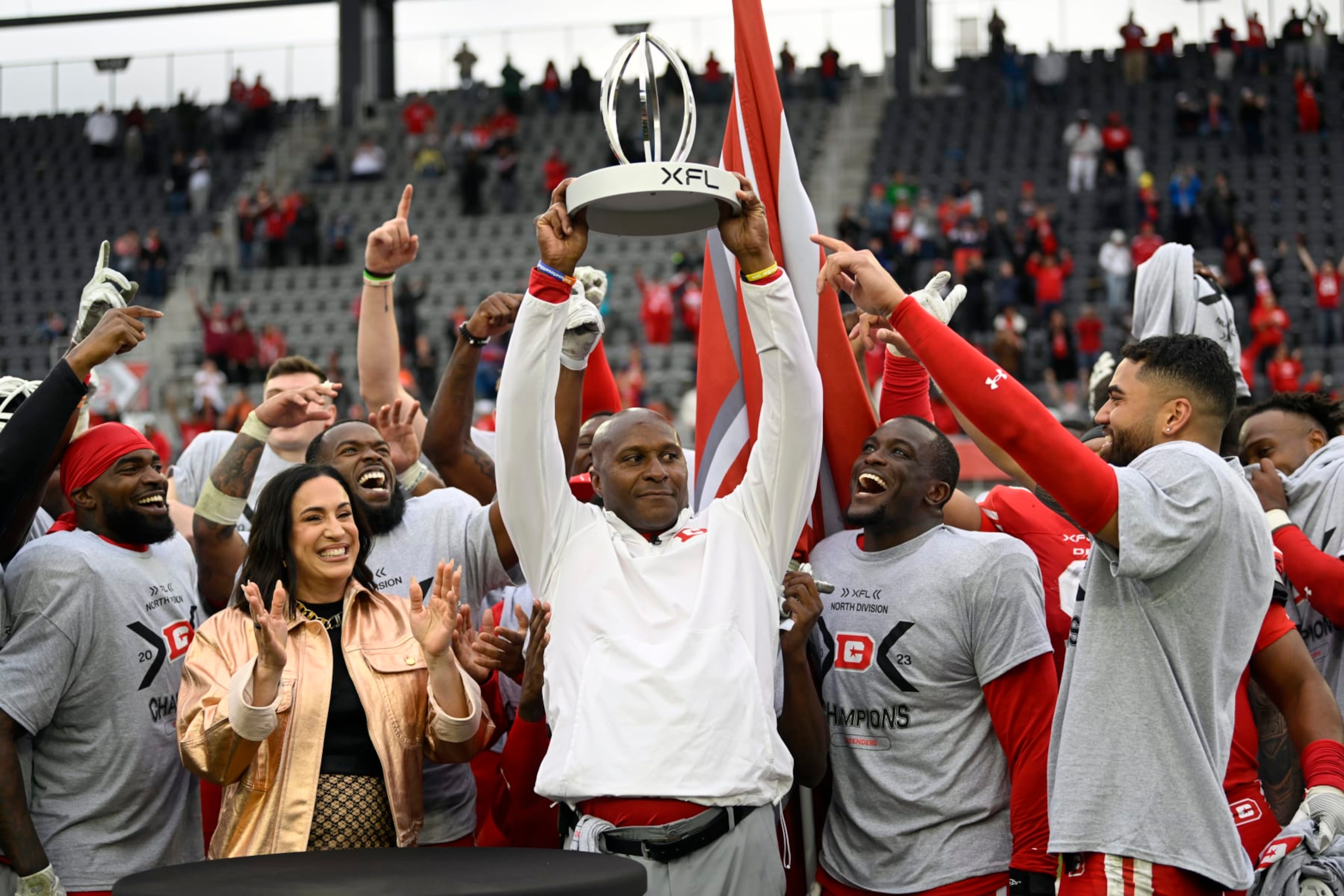 WASHINGTON, DC - APRIL 30: Defenders head coach Reggie Barlow, center hold up the division trophy after the DC Defenders defeat the Seattle Sea Dragons 37-21 for the XFL North Division Championship on April 30, 2023 at Audi Field in Washington, DC. (Photo by John McDonnell/The Washington Post via Getty Images) WASHINGTON, DC - APRIL 30: Defenders head coach Reggie Barlow, center hold up the division trophy after the DC Defenders defeat the Seattle Sea Dragons 37-21 for the XFL North Division Championship on April 30, 2023 at Audi Field in Washington, DC. (Photo by John McDonnell/The Washington Post via Getty Images)