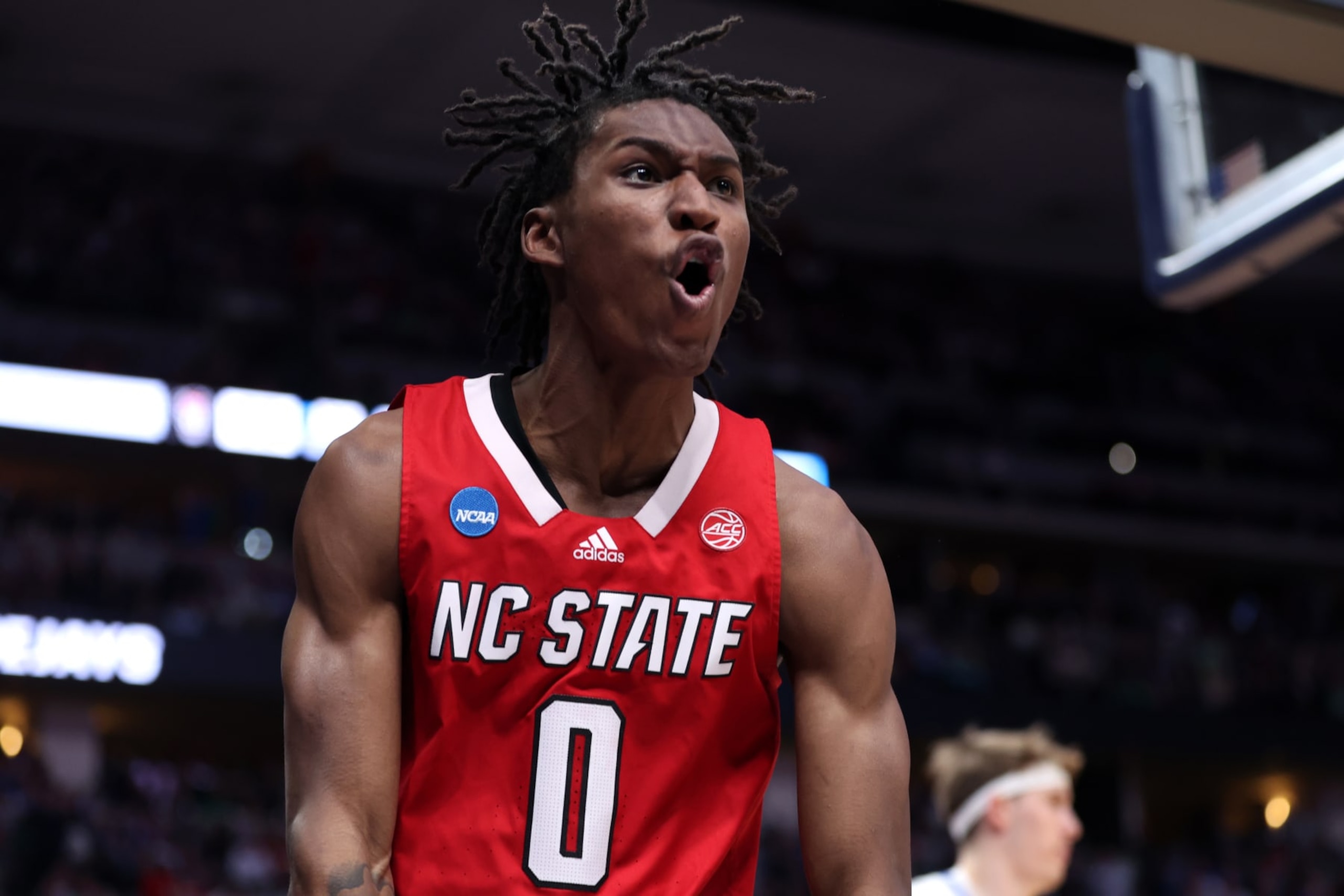 DENVER, COLORADO - MARCH 17: Terquavion Smith #0 of the North Carolina State Wolfpack reacts after a dunk during the second half against the Creighton Bluejays in the first round of the NCAA Men's Basketball Tournament at Ball Arena on March 17, 2023 in Denver, Colorado. (Photo by Sean M. Haffey/Getty Images)