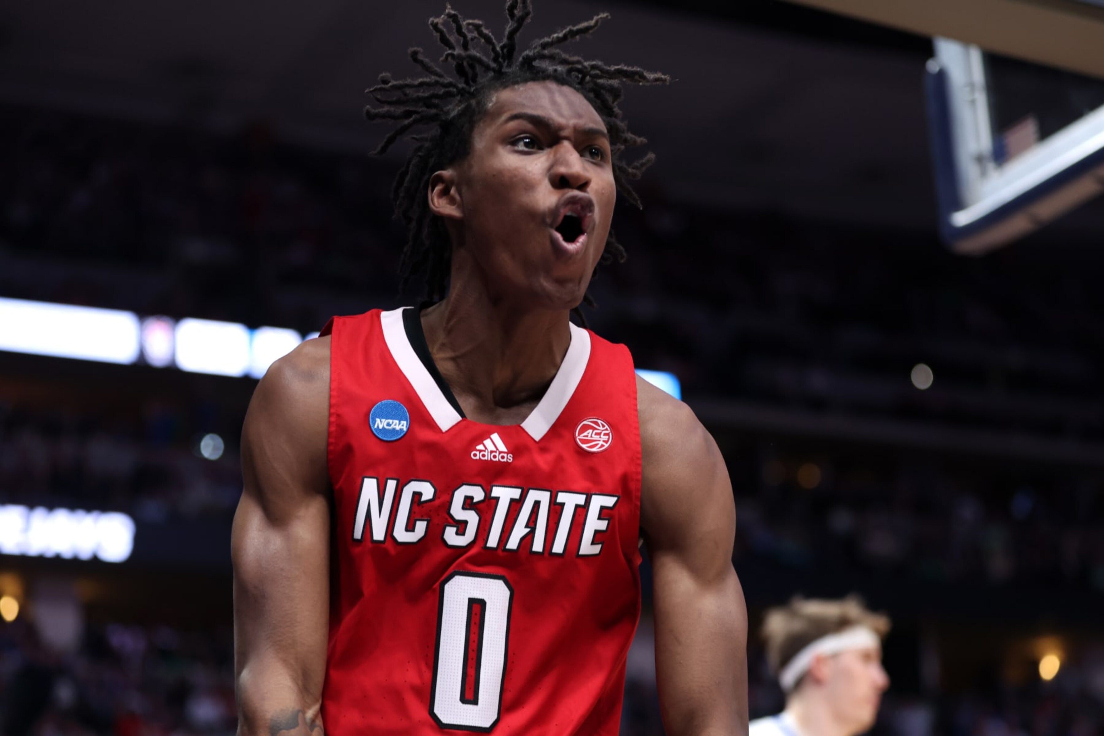 DENVER, COLORADO - MARCH 17: Terquavion Smith #0 of the North Carolina State Wolfpack reacts after a dunk during the second half against the Creighton Bluejays in the first round of the NCAA Men's Basketball Tournament at Ball Arena on March 17, 2023 in Denver, Colorado. (Photo by Sean M. Haffey/Getty Images)
