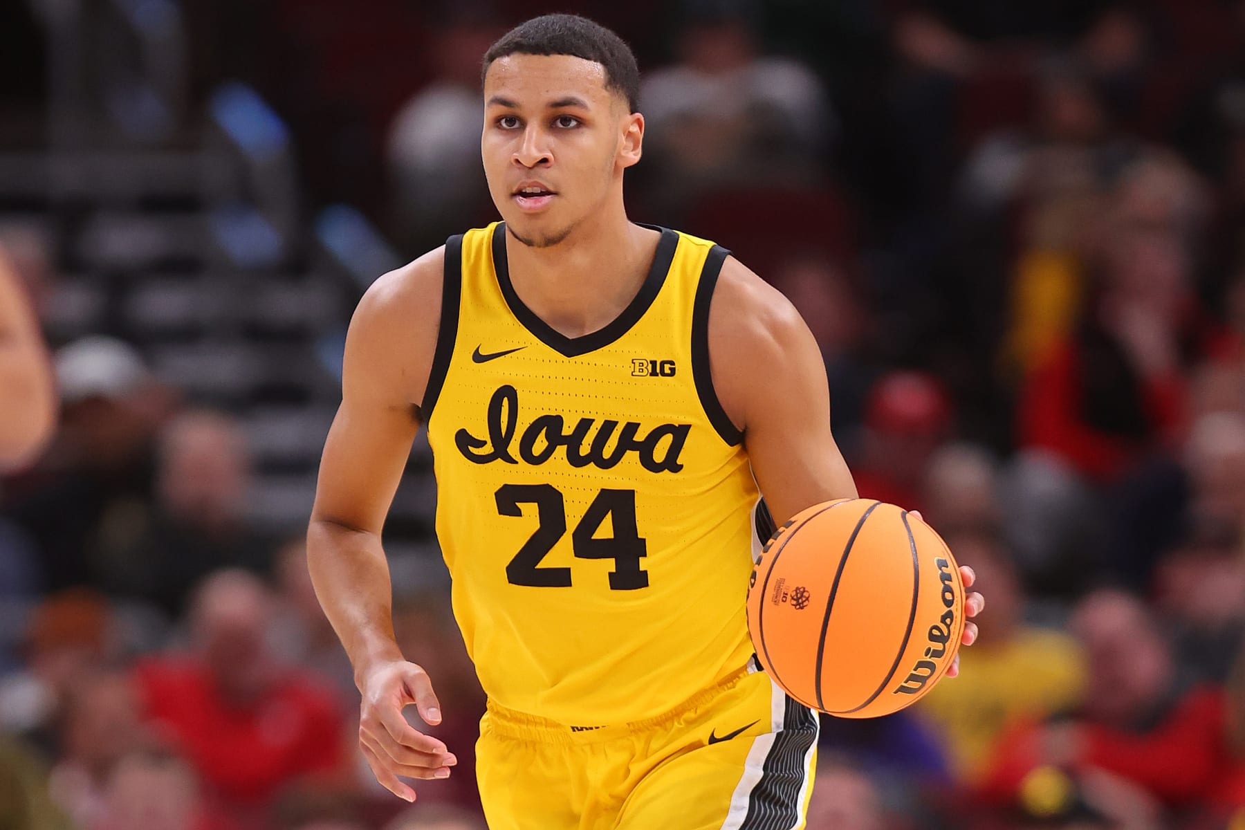 CHICAGO, ILLINOIS - MARCH 09: Kris Murray #24 of the Iowa Hawkeyes dribbles against the Ohio State Buckeyes in the first half of the second round in the Big Ten Tournament at United Center on March 09, 2023 in Chicago, Illinois. (Photo by Michael Reaves/Getty Images)