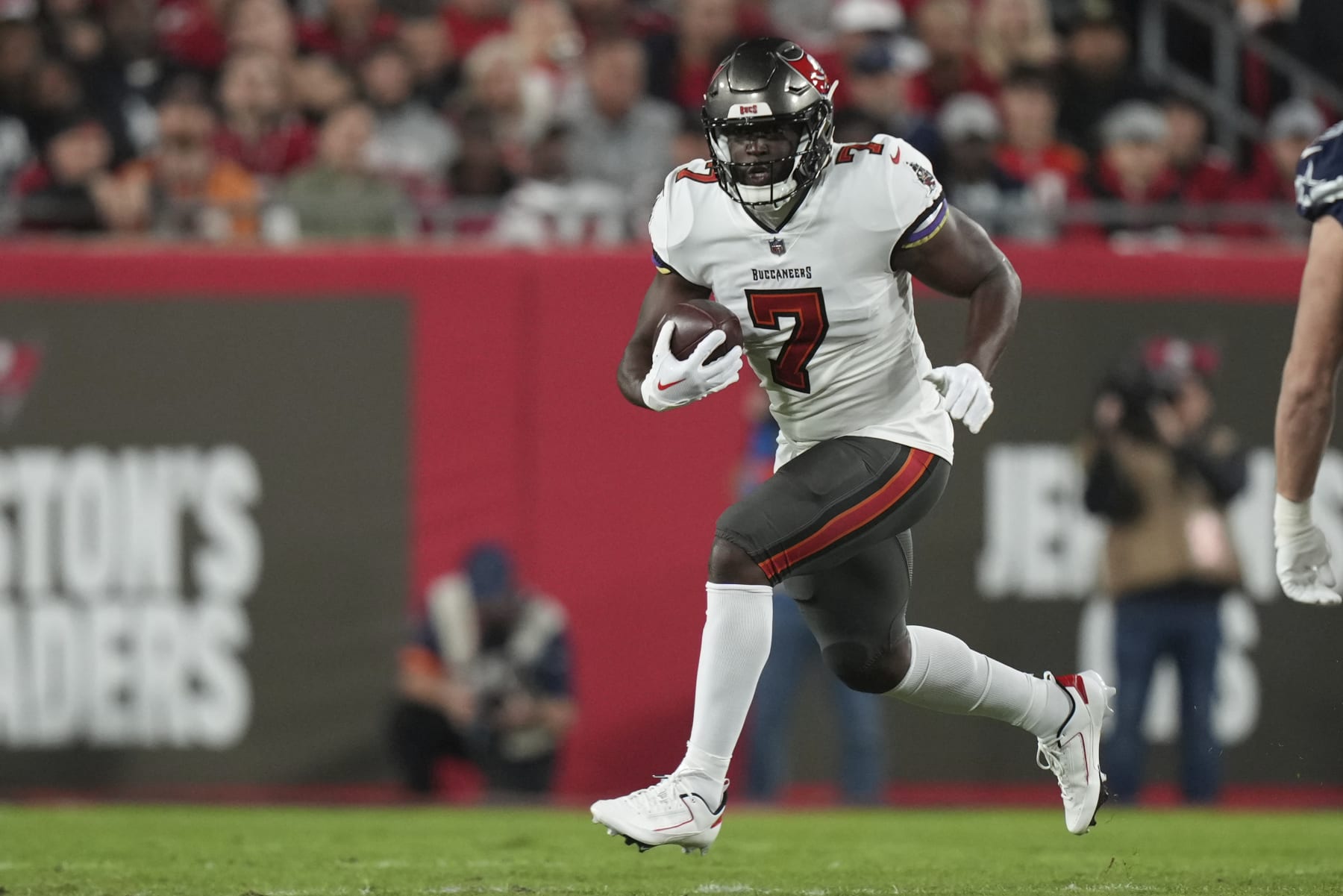 Tampa Bay Buccaneers running back Leonard Fournette (7) rushes with the ball during an NFL wild-card football game against the Dallas Cowboys, Monday, Jan. 16, 2023, in Tampa, Fla. (AP Photo/Peter Joneleit)