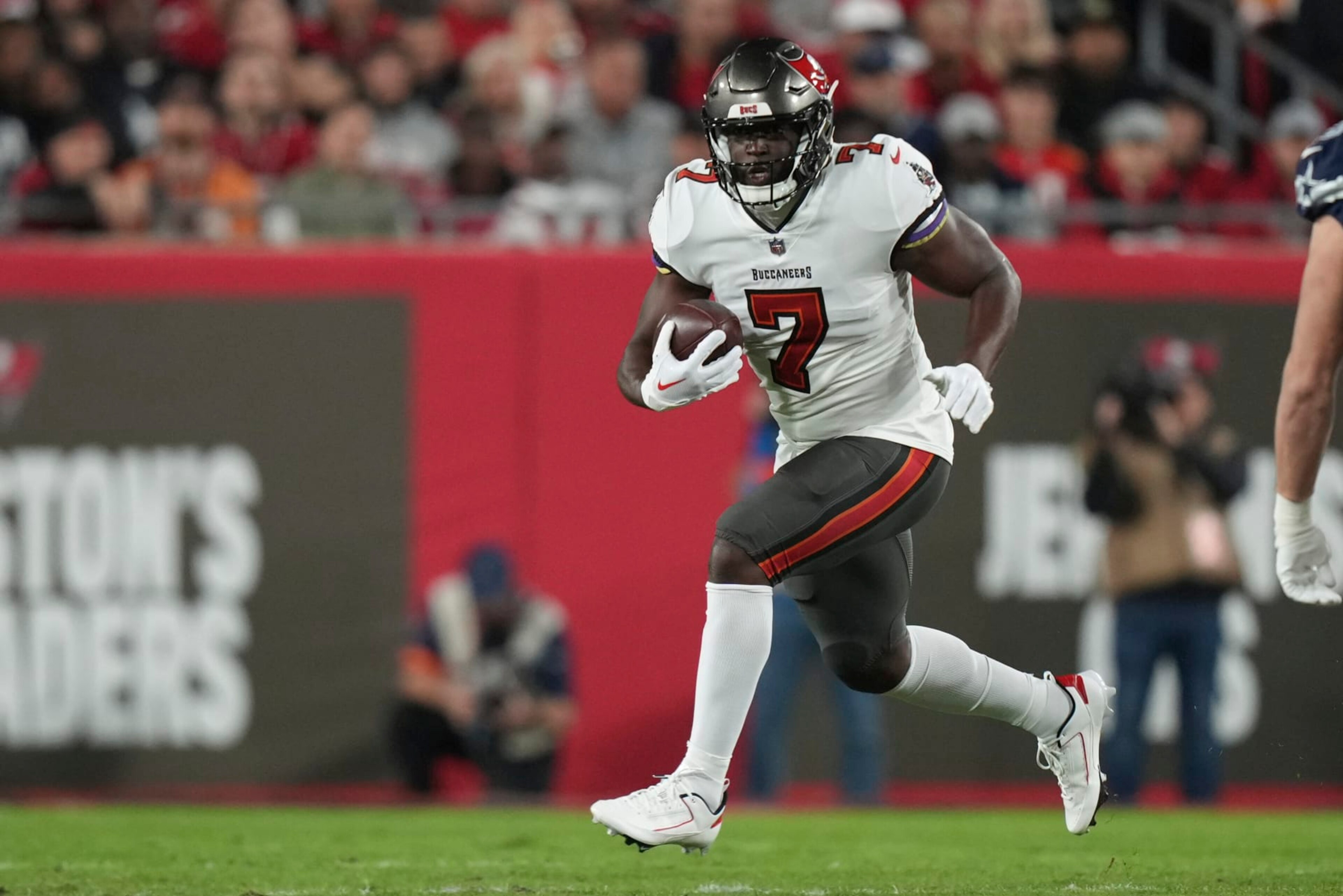 Tampa Bay Buccaneers running back Leonard Fournette (7) rushes with the ball during an NFL wild-card football game against the Dallas Cowboys, Monday, Jan. 16, 2023, in Tampa, Fla. (AP Photo/Peter Joneleit) Tampa Bay Buccaneers running back Leonard Fournette (7) rushes with the ball during an NFL wild-card football game against the Dallas Cowboys, Monday, Jan. 16, 2023, in Tampa, Fla. (AP Photo/Peter Joneleit)