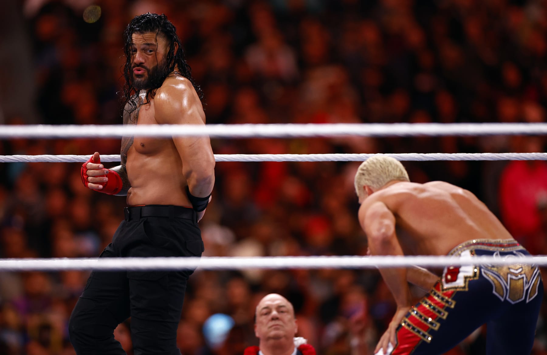 INGLEWOOD, CALIFORNIA - APRIL 02:  (L-R) Roman Reigns wrestles Cody Rhodes for Undisputed WWE Universal Title Match during WrestleMania Goes Hollywood at SoFi Stadium on April 02, 2023 in Inglewood, California.  (Photo by Ronald Martinez/Getty Images)