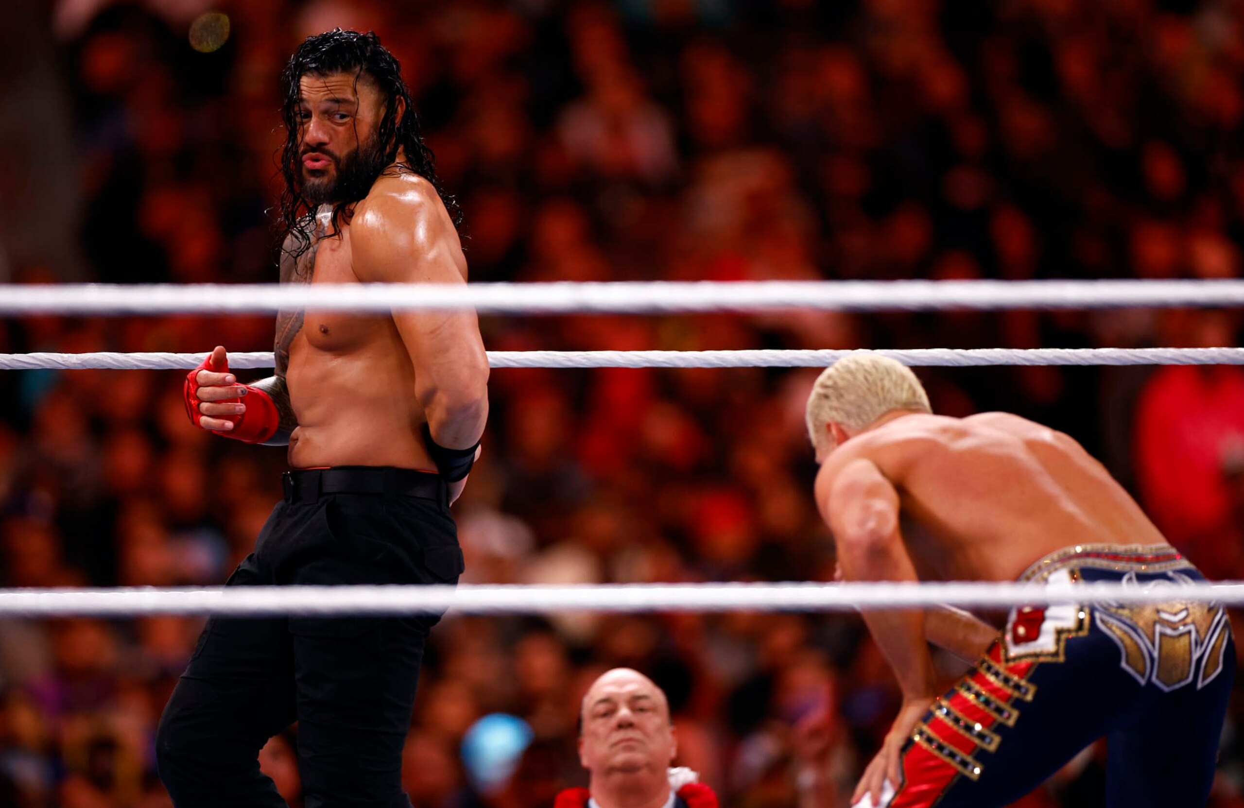 INGLEWOOD, CALIFORNIA - APRIL 02:  (L-R) Roman Reigns wrestles Cody Rhodes for Undisputed WWE Universal Title Match during WrestleMania Goes Hollywood at SoFi Stadium on April 02, 2023 in Inglewood, California.  (Photo by Ronald Martinez/Getty Images)