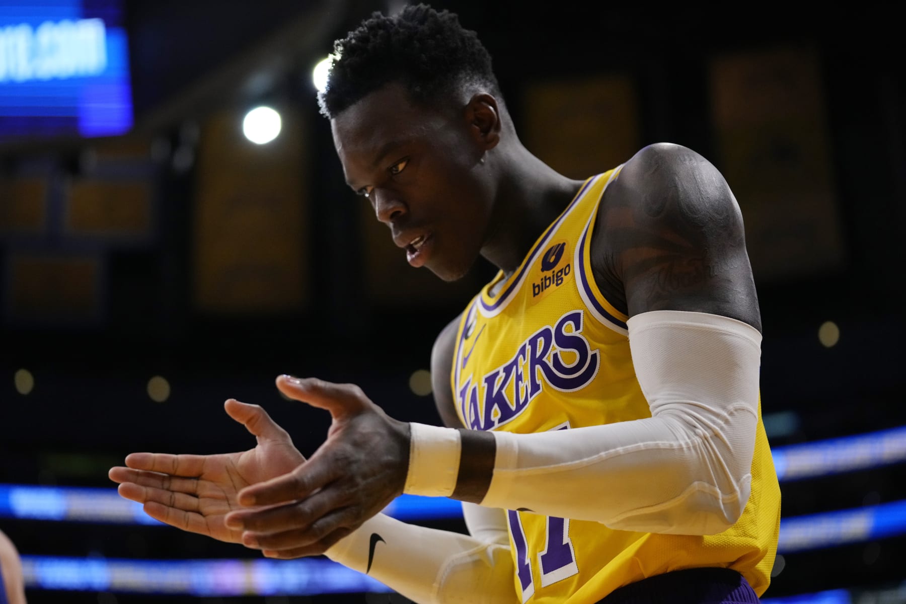 Los Angeles Lakers guard Dennis Schroder (17) claps during the first half in Game 6 of an NBA basketball Western Conference semifinal series against the Golden State Warriors Friday, May 12, 2023, in Los Angeles. (AP Photo/Ashley Landis)