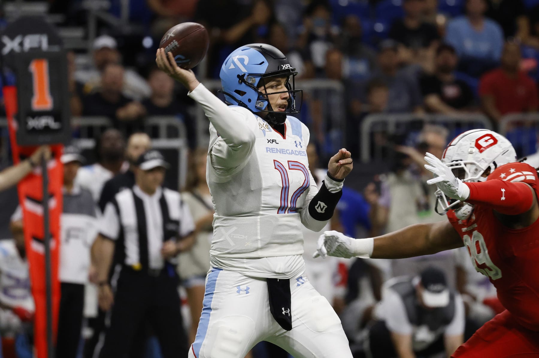 SAN ANTONIO, TX - MAY 13 : Luis Perez #12 of the Arlington Renegades looks to make a pass against DC Defenders during the first half of XFL Championship game at the Alamodome on May 13 2023 in San Antonio, Texas.  (Photo by Ronald Cortes/Getty Images)