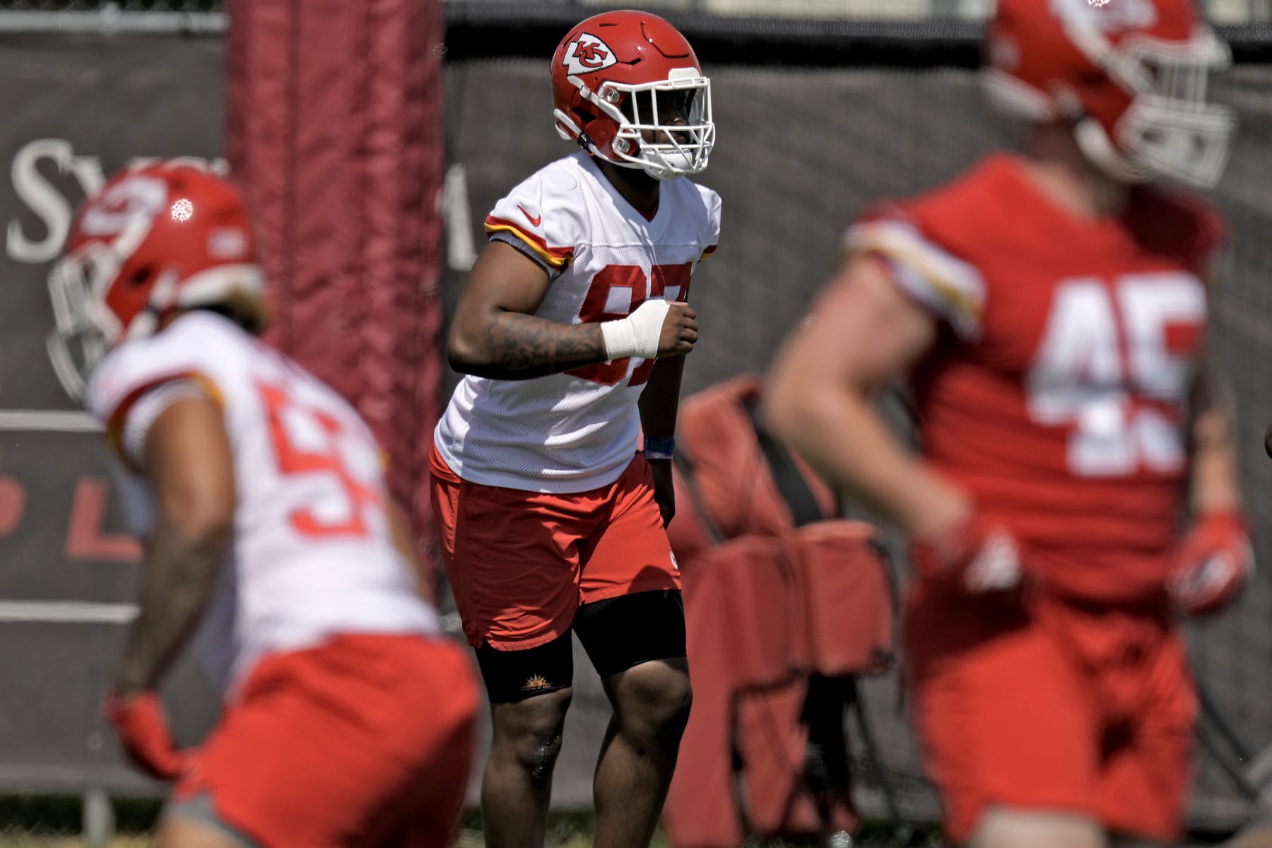Kansas City Chiefs defensive end Felix Anudike-Uzomah (97) participates in a drill during the NFL football team's rookie minicamp Monday, May 8, 2023, in Kansas City, Mo. (AP Photo/Charlie Riedel)