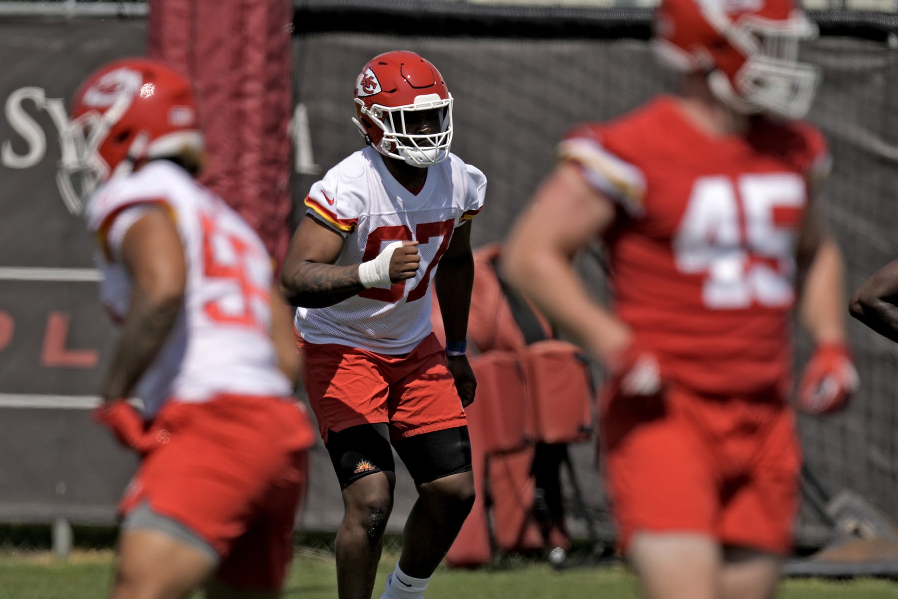 Kansas City Chiefs defensive end Felix Anudike-Uzomah (97) participates in a drill during the NFL football team's rookie minicamp Monday, May 8, 2023, in Kansas City, Mo. (AP Photo/Charlie Riedel)