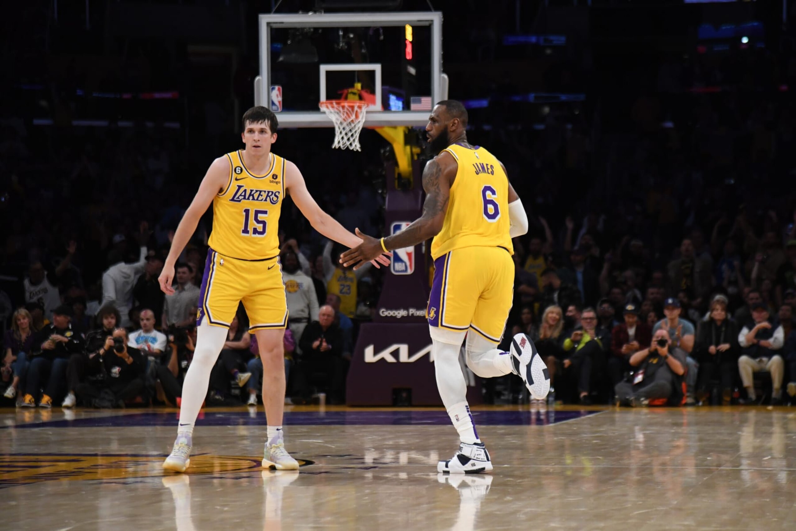 LOS ANGELES, CA - MAY 12: Austin Reaves #15 and LeBron James #6 of the Los Angeles Lakers high five during Game Six of the Western Conference Semi-Finals of the 2023 NBA Playoffs against the Golden State Warriors on May 12, 2023 at Crypto.com Arena in Los Angeles, California. NOTE TO USER: User expressly acknowledges and agrees that, by downloading and/or using this Photograph, user is consenting to the terms and conditions of the Getty Images License Agreement. Mandatory Copyright Notice: Copyright 2023 NBAE (Photo by Noah Graham/NBAE via Getty Images)