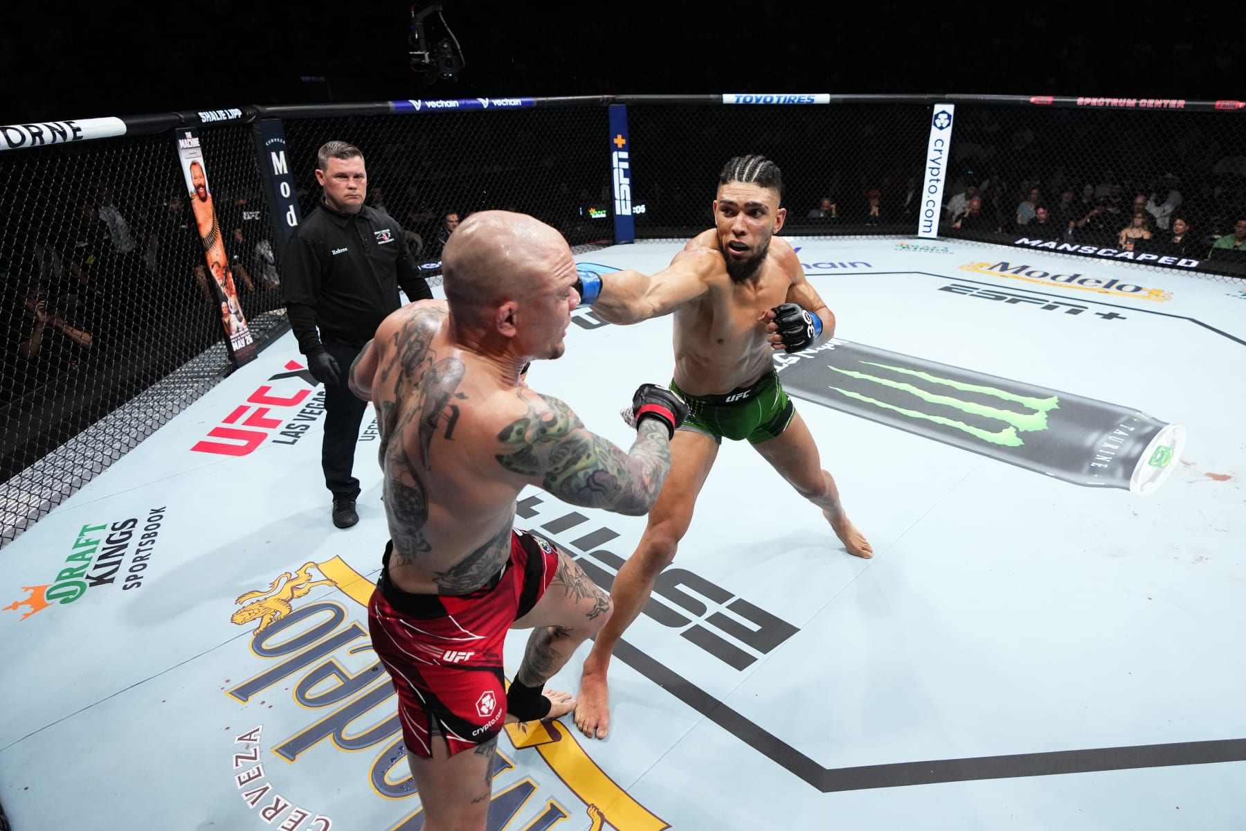 CHARLOTTE, NORTH CAROLINA - MAY 13:  (R-L) Johnny Walker of Brazil punches Anthony Smith in their light heavyweight fight during the UFC Fight Night event at Spectrum Center on May 13, 2023 in Charlotte, North Carolina. (Photo by Jeff Bottari/Zuffa LLC via Getty Images)