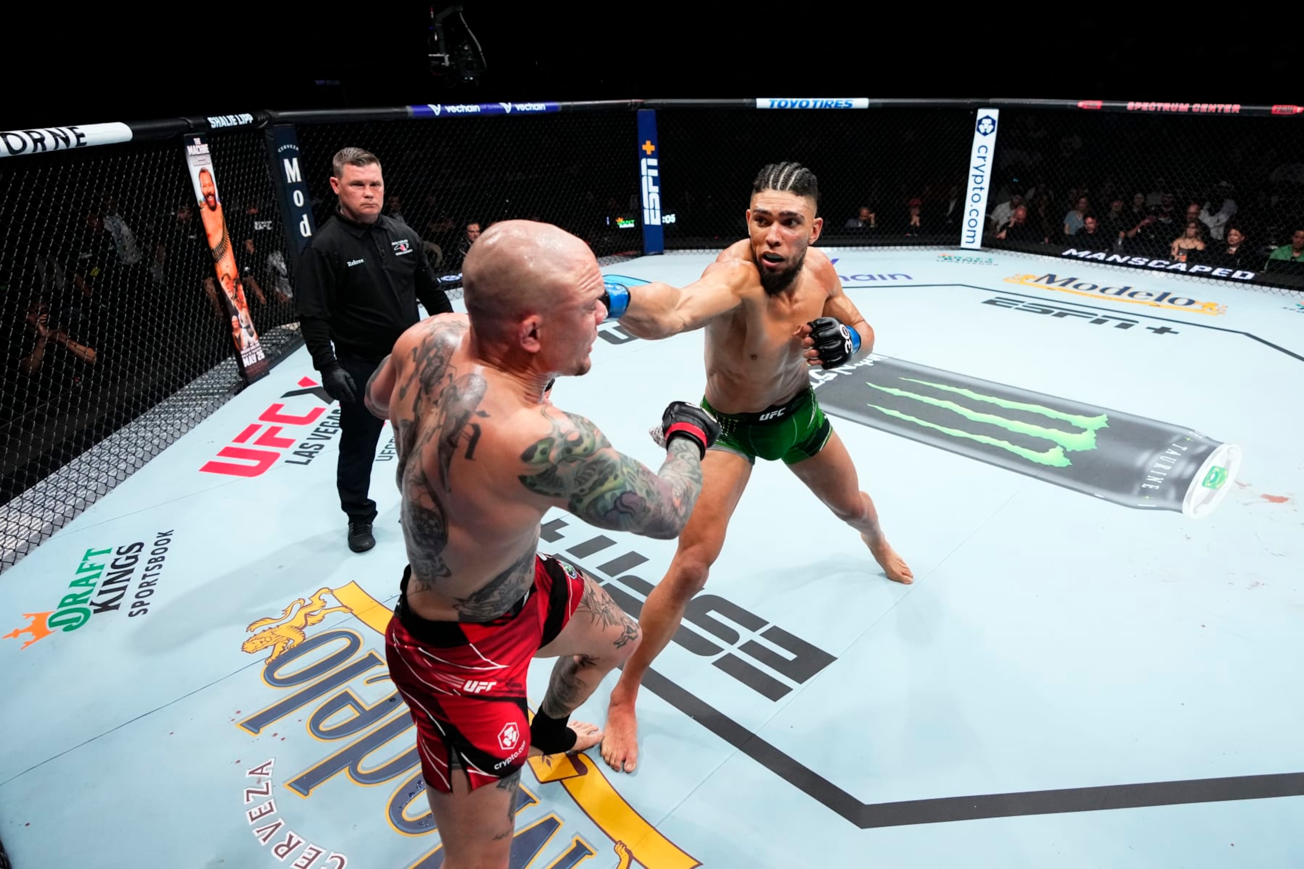 CHARLOTTE, NORTH CAROLINA - MAY 13:  (R-L) Johnny Walker of Brazil punches Anthony Smith in their light heavyweight fight during the UFC Fight Night event at Spectrum Center on May 13, 2023 in Charlotte, North Carolina. (Photo by Jeff Bottari/Zuffa LLC via Getty Images)