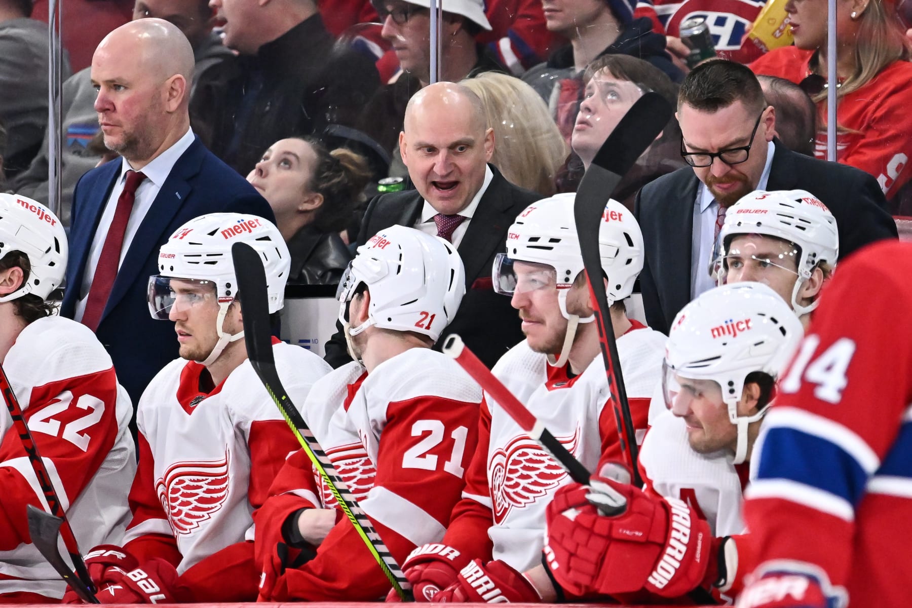 MONTREAL, CANADA - APRIL 04:  Head coach of the Detroit Red Wings Derek Lalonde (C) handles bench duties during the second period against the Montreal Canadiens at Centre Bell on April 4, 2023 in Montreal, Quebec, Canada.  The Detroit Red Wings defeated the Montreal Canadiens 5-0.  (Photo by Minas Panagiotakis/Getty Images)