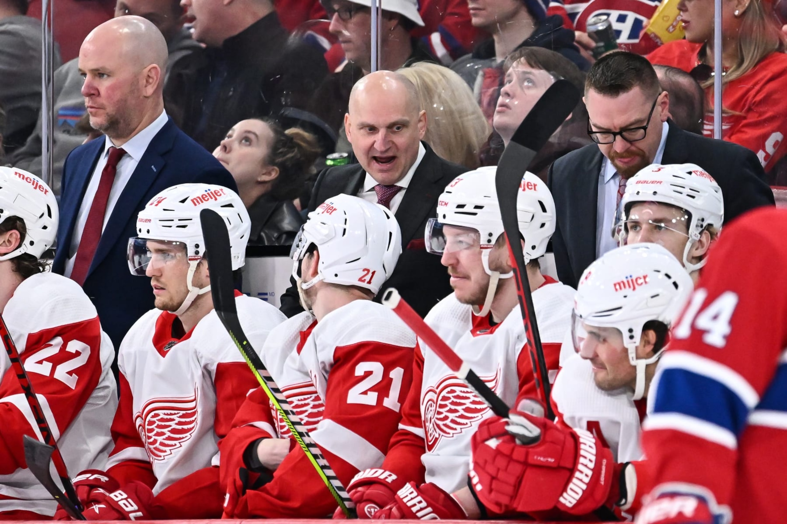 MONTREAL, CANADA - APRIL 04:  Head coach of the Detroit Red Wings Derek Lalonde (C) handles bench duties during the second period against the Montreal Canadiens at Centre Bell on April 4, 2023 in Montreal, Quebec, Canada.  The Detroit Red Wings defeated the Montreal Canadiens 5-0.  (Photo by Minas Panagiotakis/Getty Images)