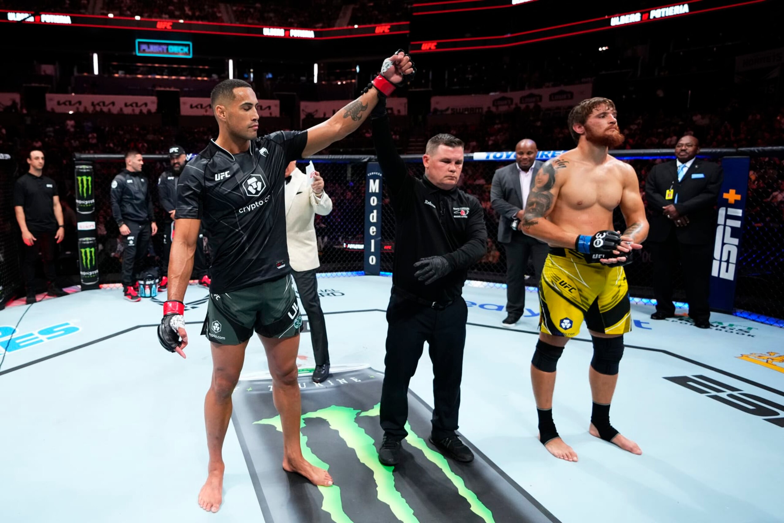 CHARLOTTE, NORTH CAROLINA - MAY 13:  (L-R) Carlos Ulberg of New Zealand reacts after his TKO victory over Ihor Potieria of Ukraine in their light heavyweight fight during the UFC Fight Night event at Spectrum Center on May 13, 2023 in Charlotte, North Carolina. (Photo by Jeff Bottari/Zuffa LLC via Getty Images)