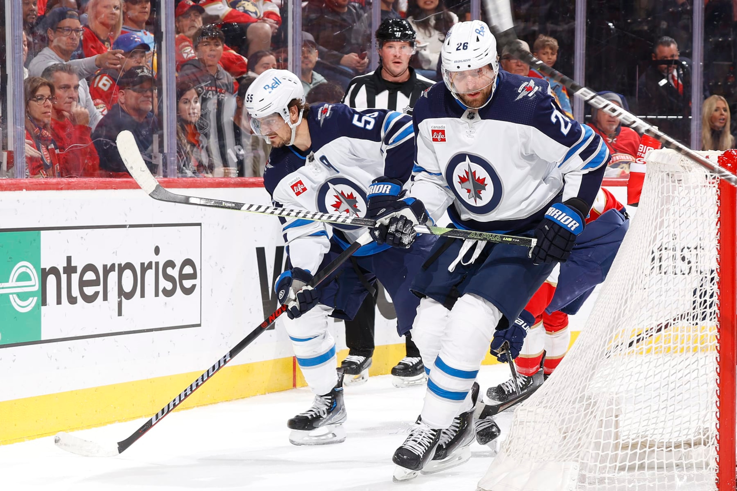 SUNRISE, FL - MARCH 11: Mark Scheifele #55 and Blake Wheeler #26 of the Winnipeg Jets skate behind the Florida Panthers net with the puck during second period action at the FLA Live Arena on March 11, 2023 in Sunrise, Florida. (Photo by Joel Auerbach/Getty Images)
