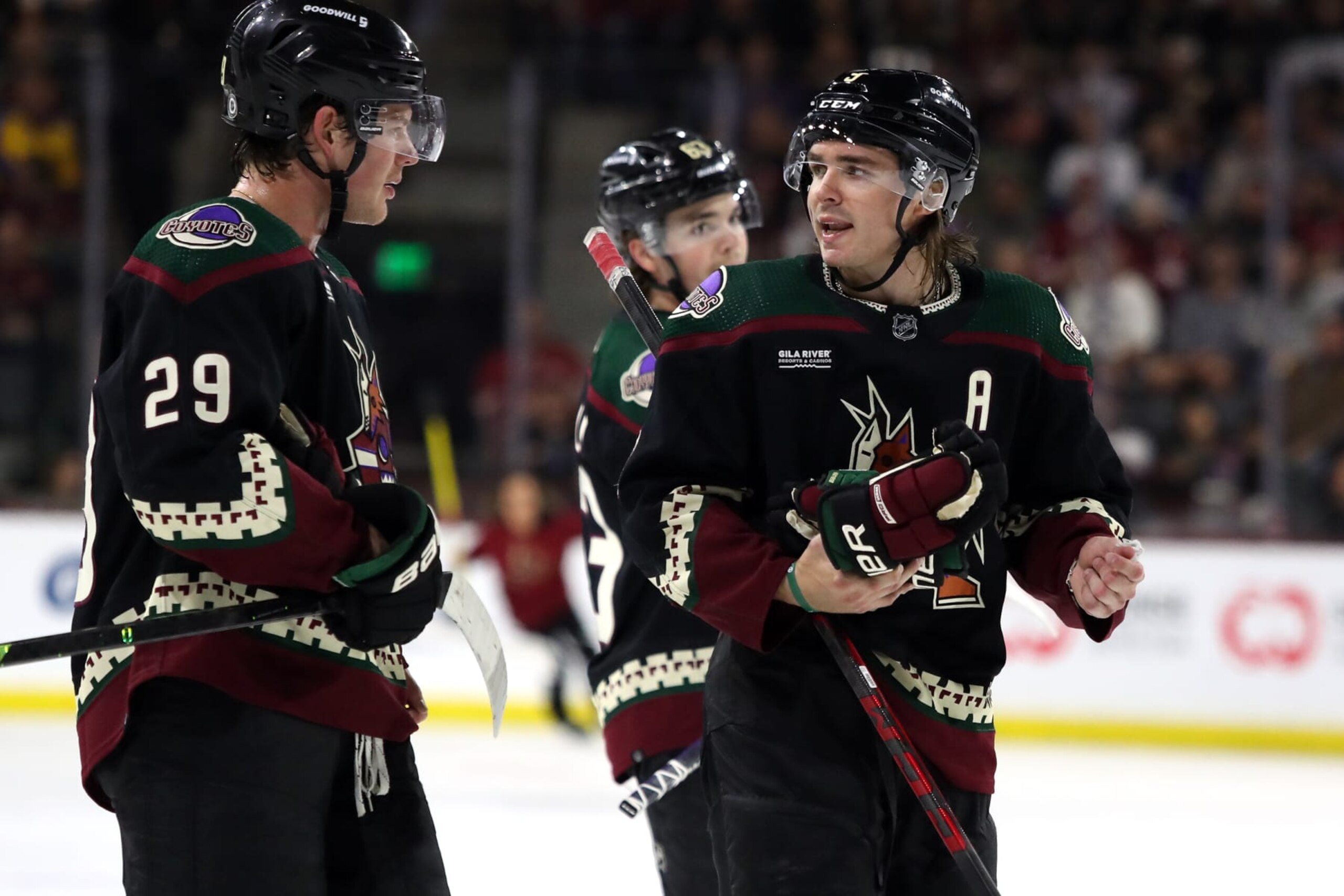 TEMPE, ARIZONA - APRIL 13: Clayton Keller #9 of the Arizona Coyotes talks the Barrett Hayton #29 before a faceoff against the Vancouver Canucks at Mullett Arena on April 13, 2023 in Tempe, Arizona. (Photo by Zac BonDurant/Getty Images)