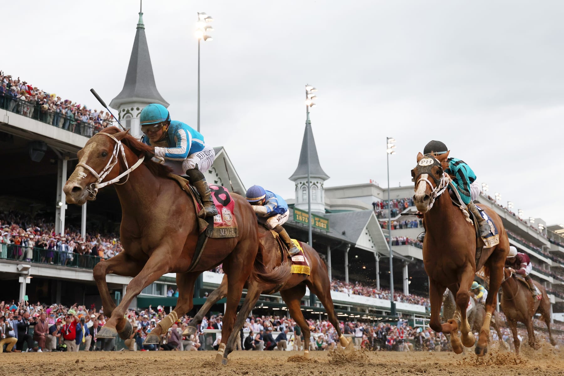 LOUISVILLE, KENTUCKY - MAY 06: Mage #8, ridden by jockey Javier Castellano crosses the finish line to win the 149th running of the Kentucky Derby at Churchill Downs on May 06, 2023 in Louisville, Kentucky. (Photo by Michael Reaves/Getty Images)