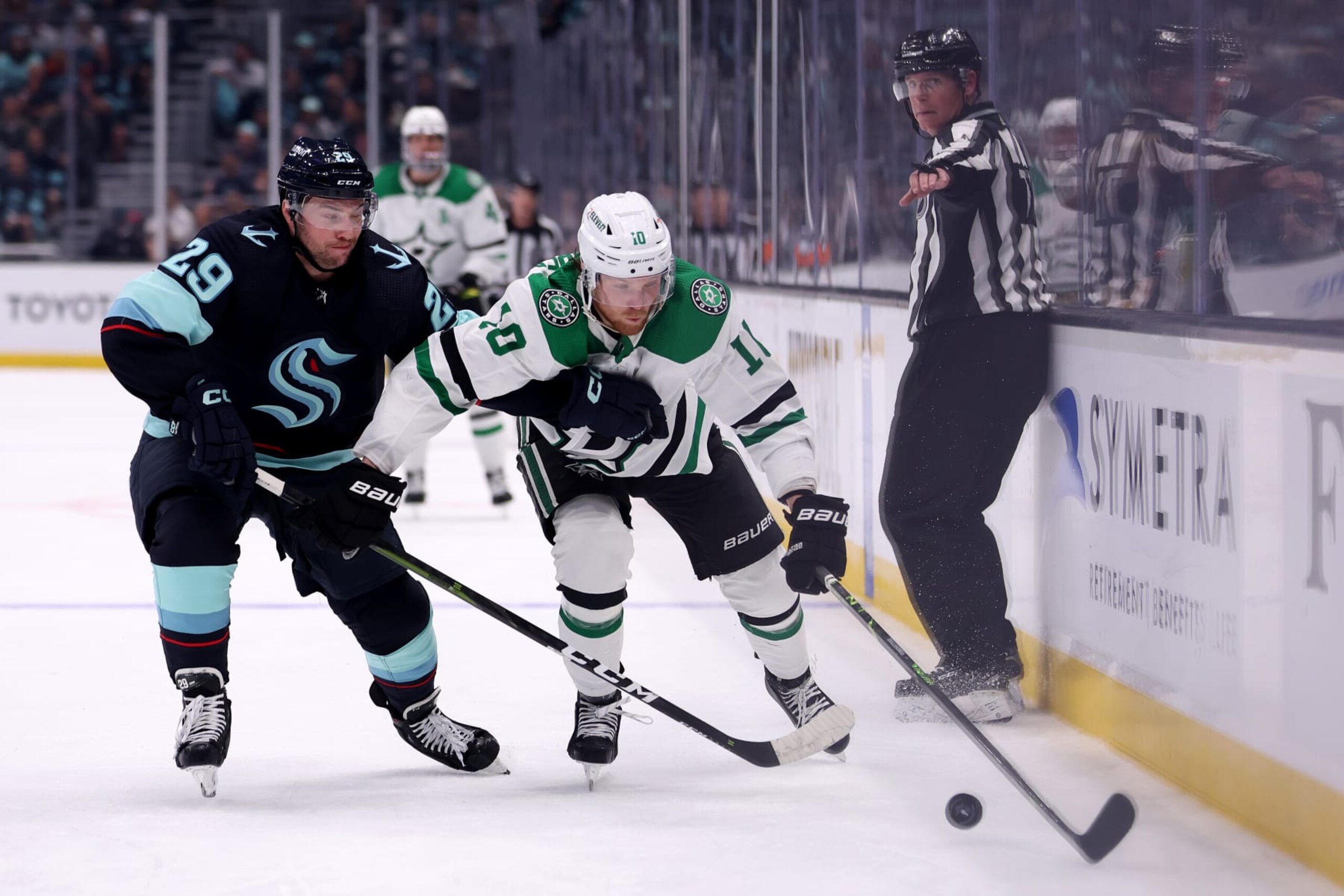 SEATTLE, WASHINGTON - MAY 13: Vince Dunn #29 of the Seattle Kraken defends Ty Dellandrea #10 of the Dallas Stars during the third period in Game Six of the Second Round of the 2023 Stanley Cup Playoffs at Climate Pledge Arena on May 13, 2023 in Seattle, Washington. (Photo by Steph Chambers/Getty Images)