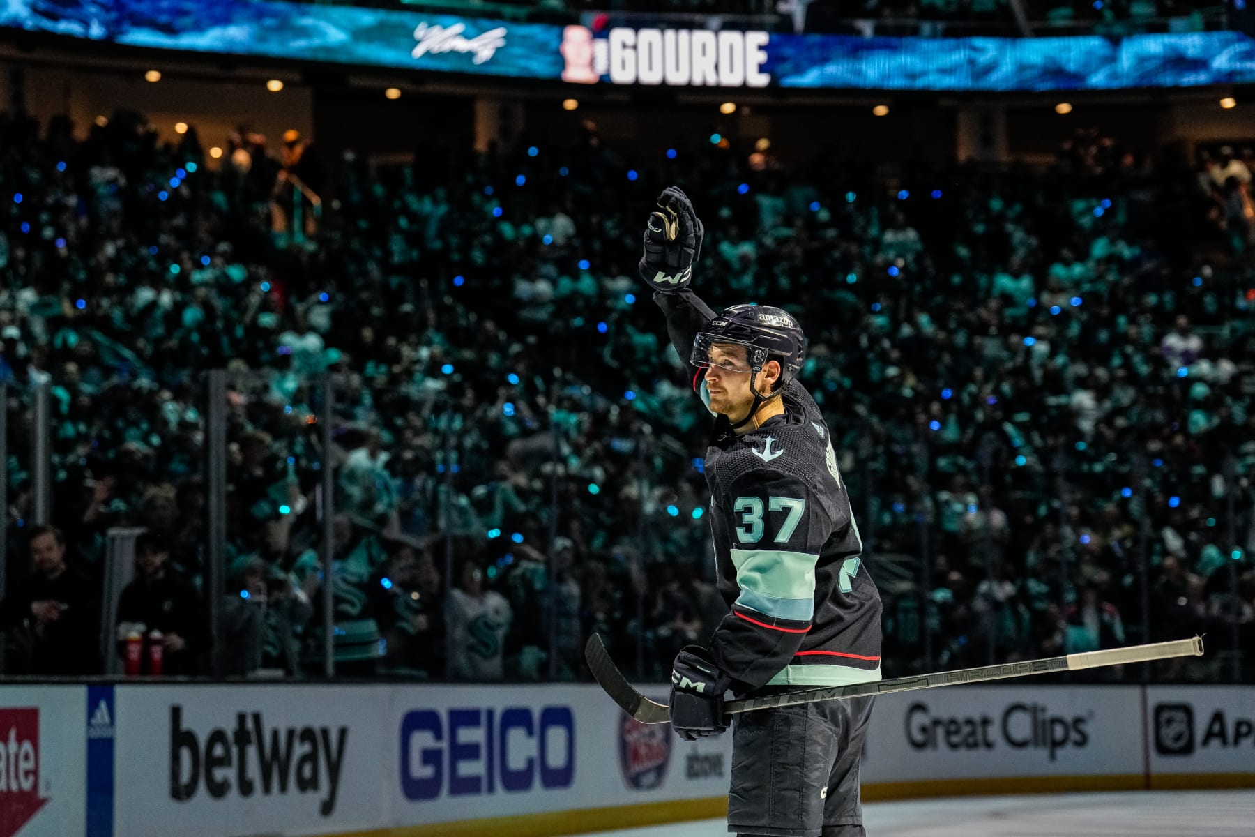 SEATTLE, WASHINGTON - MAY 12: Yanni Gourde #37 of the Seattle Kraken waves to the crowd after a victory against the Dallas Stars in Game Six of the Second Round of the 2023 Stanley Cup Playoffs at Climate Pledge Arena on May 12, 2023 in Seattle, Washington. (Photo by Christopher Mast/NHLI via Getty Images)