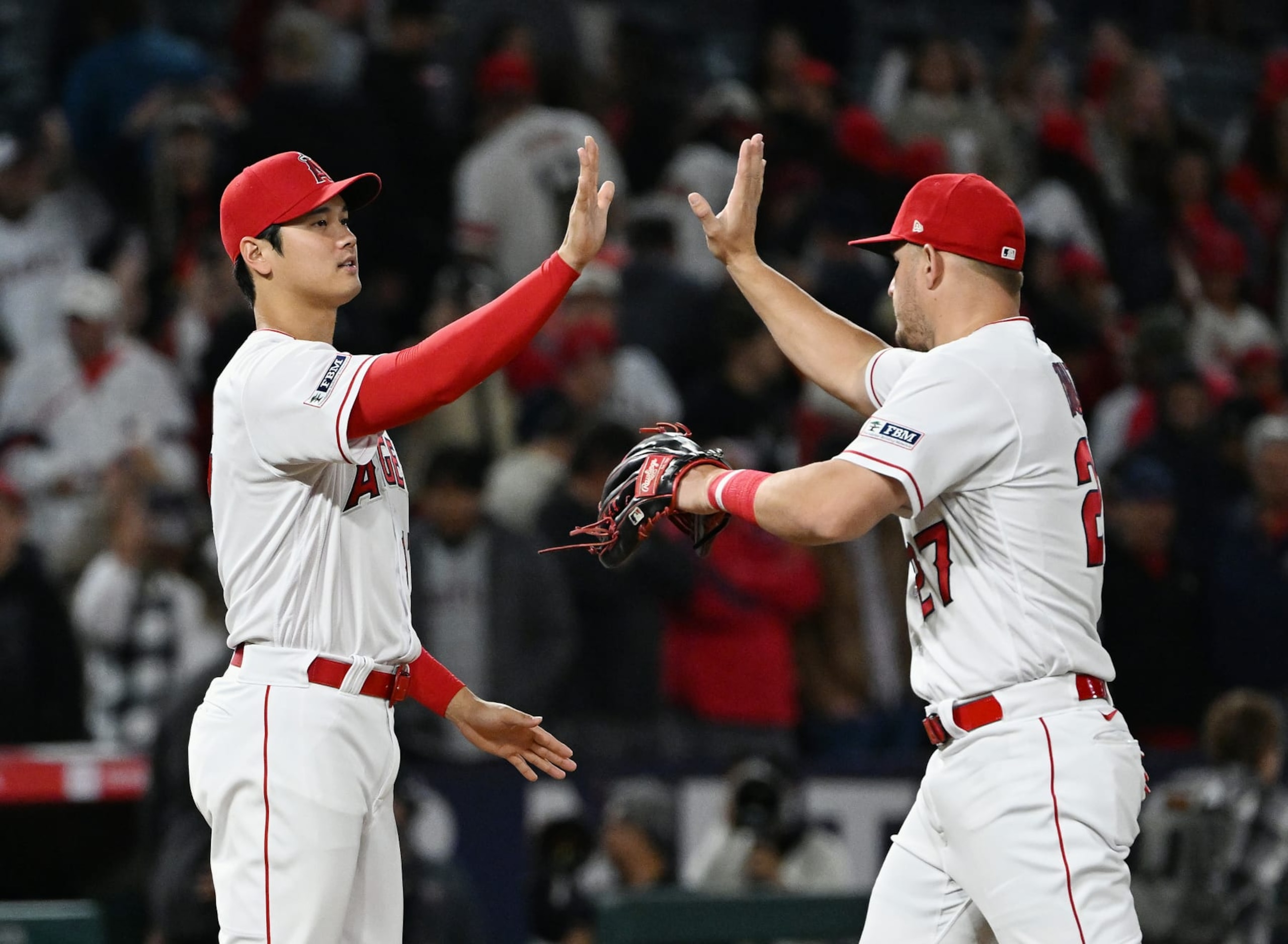 Shohei Ohtani (L) and Mike Trout (R) of the Los Angeles Angels