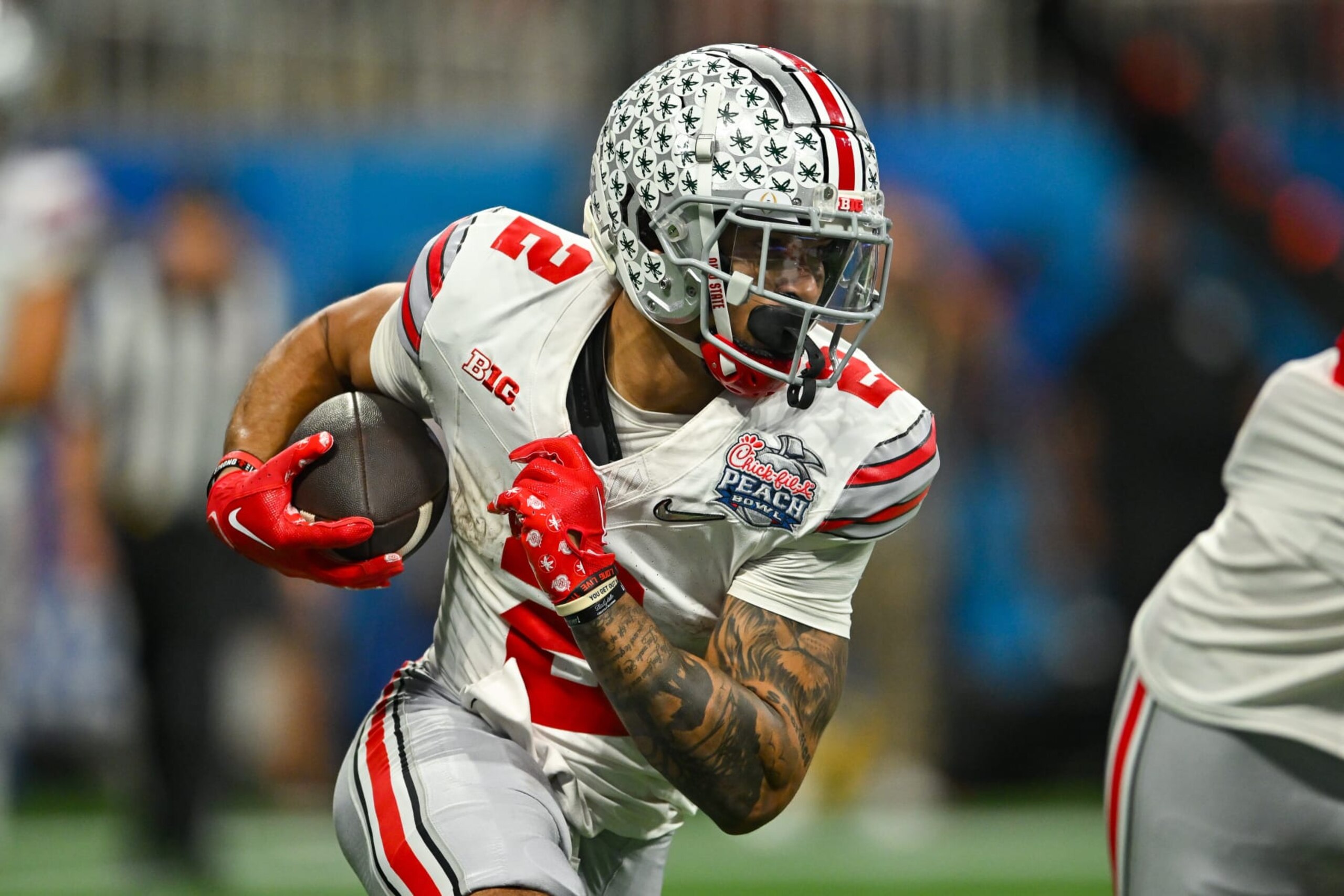 ATLANTA, GA  DECEMBER 31:  Ohio State wide receiver Emeka Egbuka (2) runs with the ball during the Chick-fil-A Peach Bowl semifinal college football playoff between the Ohio State Buckeyes and the Georgia Bulldogs on December 31st, 2022 at Mercedes-Benz Stadium in Atlanta, GA.  (Photo by Rich von Biberstein/Icon Sportswire via Getty Images)