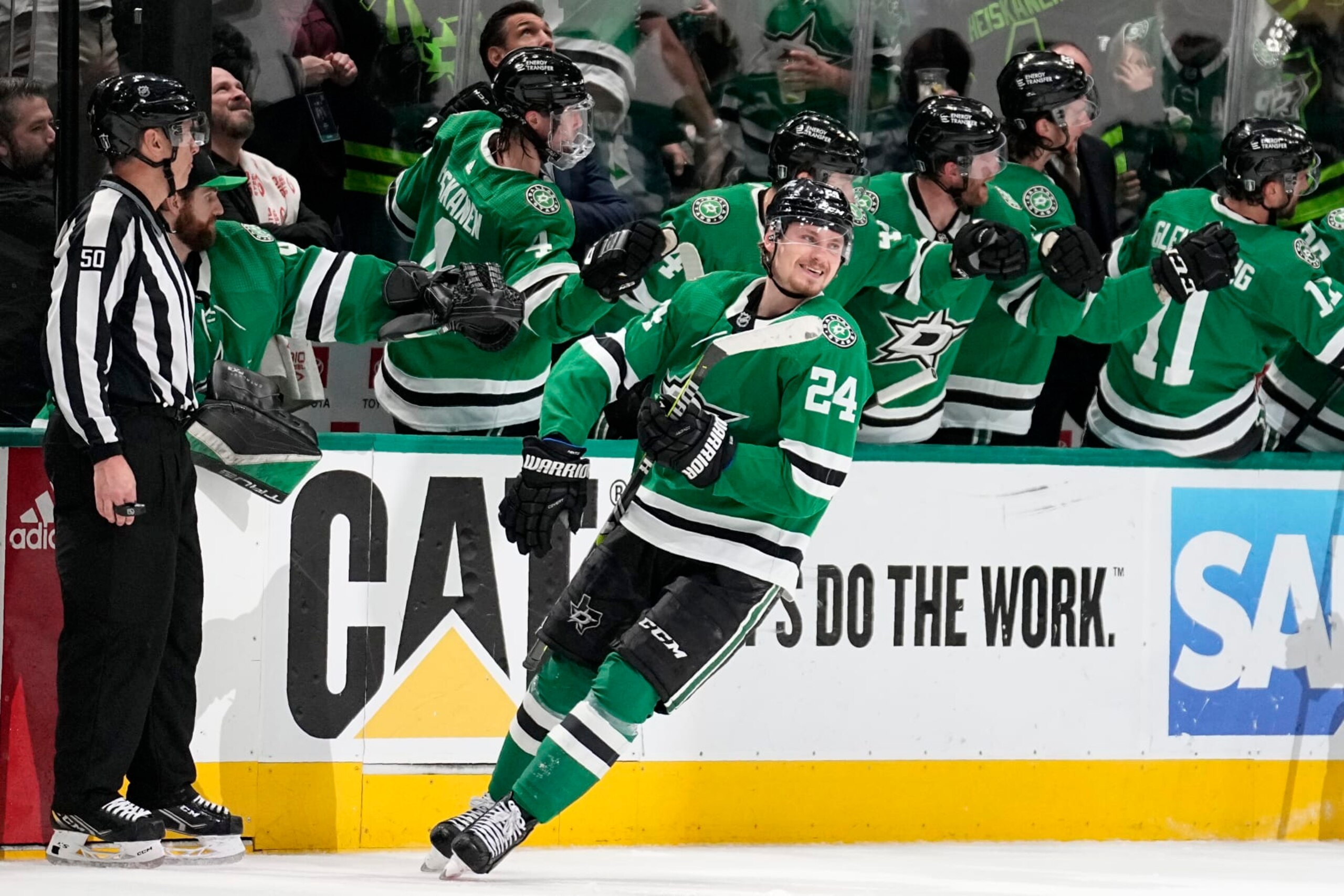 Dallas Stars center Roope Hintz (24) smiles as he celebrates with the bench after scoring against the Seattle Kraken in the second period of Game 7 of an NHL hockey Stanley Cup second-round playoff series, Monday, May 15, 2023, in Dallas. (AP Photo/Tony Gutierrez) Dallas Stars center Roope Hintz (24) smiles as he celebrates with the bench after scoring against the Seattle Kraken in the second period of Game 7 of an NHL hockey Stanley Cup second-round playoff series, Monday, May 15, 2023, in Dallas. (AP Photo/Tony Gutierrez)