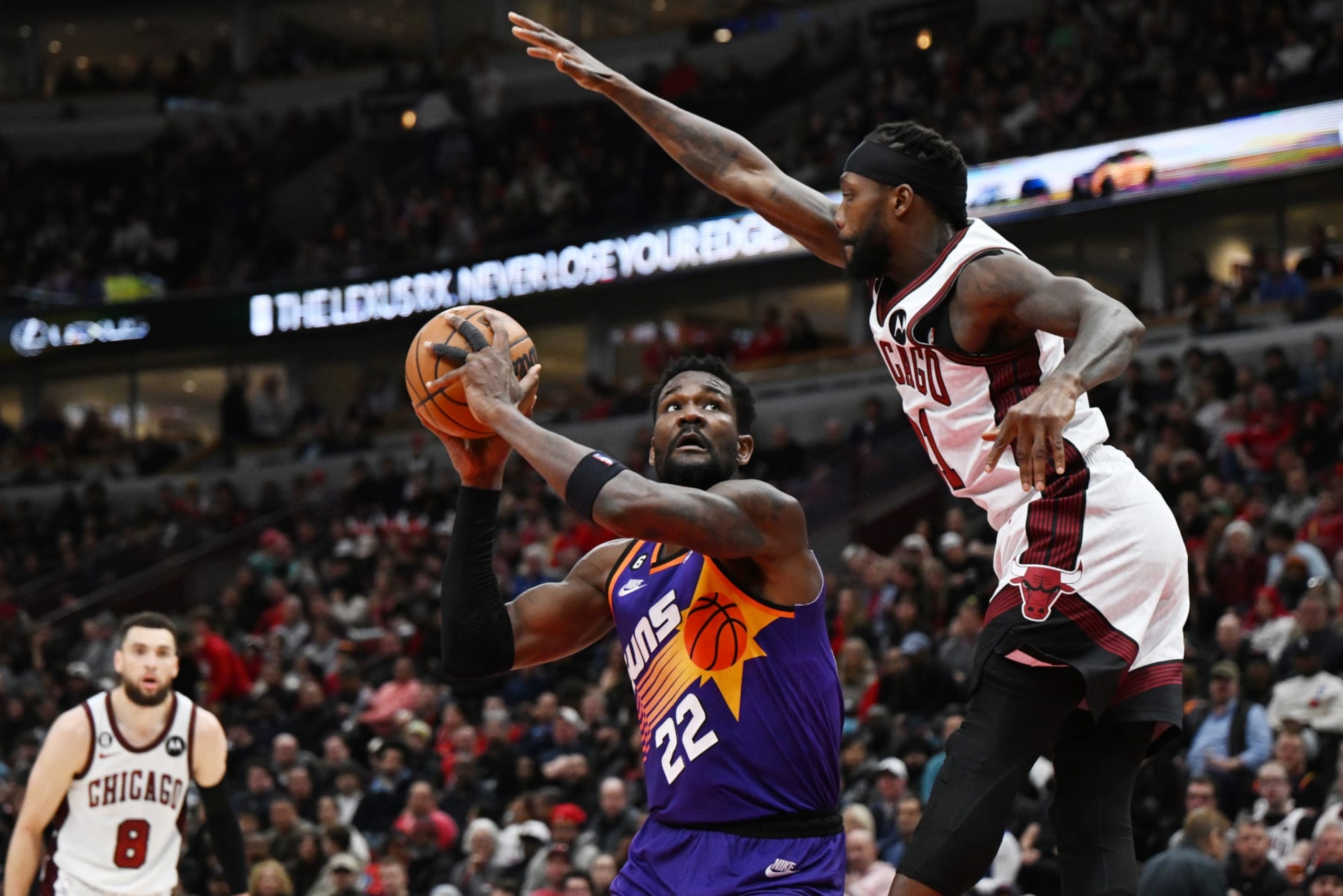 CHICAGO, ILLINOIS - MARCH 03: Deandre Ayton #22 of the Phoenix Suns shoots in the second half against Patrick Beverley #21 of the Chicago Bulls at United Center on March 03, 2023 in Chicago, Illinois.  NOTE TO USER: User expressly acknowledges and agrees that, by downloading and or using this photograph, User is consenting to the terms and conditions of the Getty Images License Agreement.  (Photo by Quinn Harris/Getty Images)