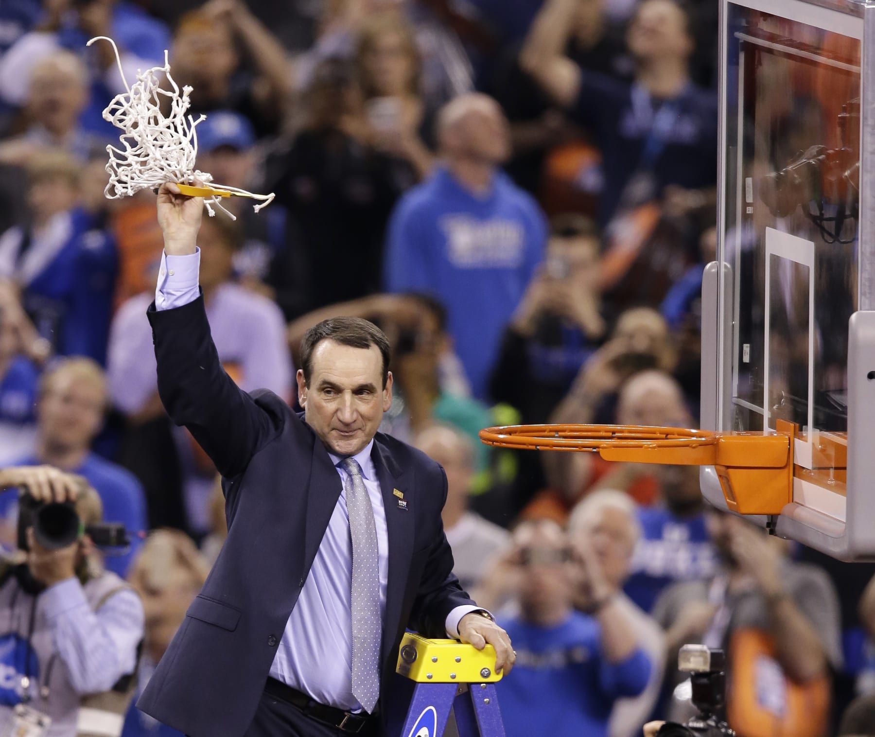FILE - In this April 6, 2015, file photo, Duke head coach Mike Krzyzewski cuts down the net after his team's 68-63 victory over Wisconsin in the NCAA Final Four college basketball tournament championship game in Indianapolis. The parallels between this Duke team and the group from 2014-15 seem too obvious to ignore: A roster dominated by one-and-done freshmen led those Blue Devils to their fifth national title, and now a repeat of that year certainly appears possible _ maybe even likely. (AP Photo/Darron Cummings, File)