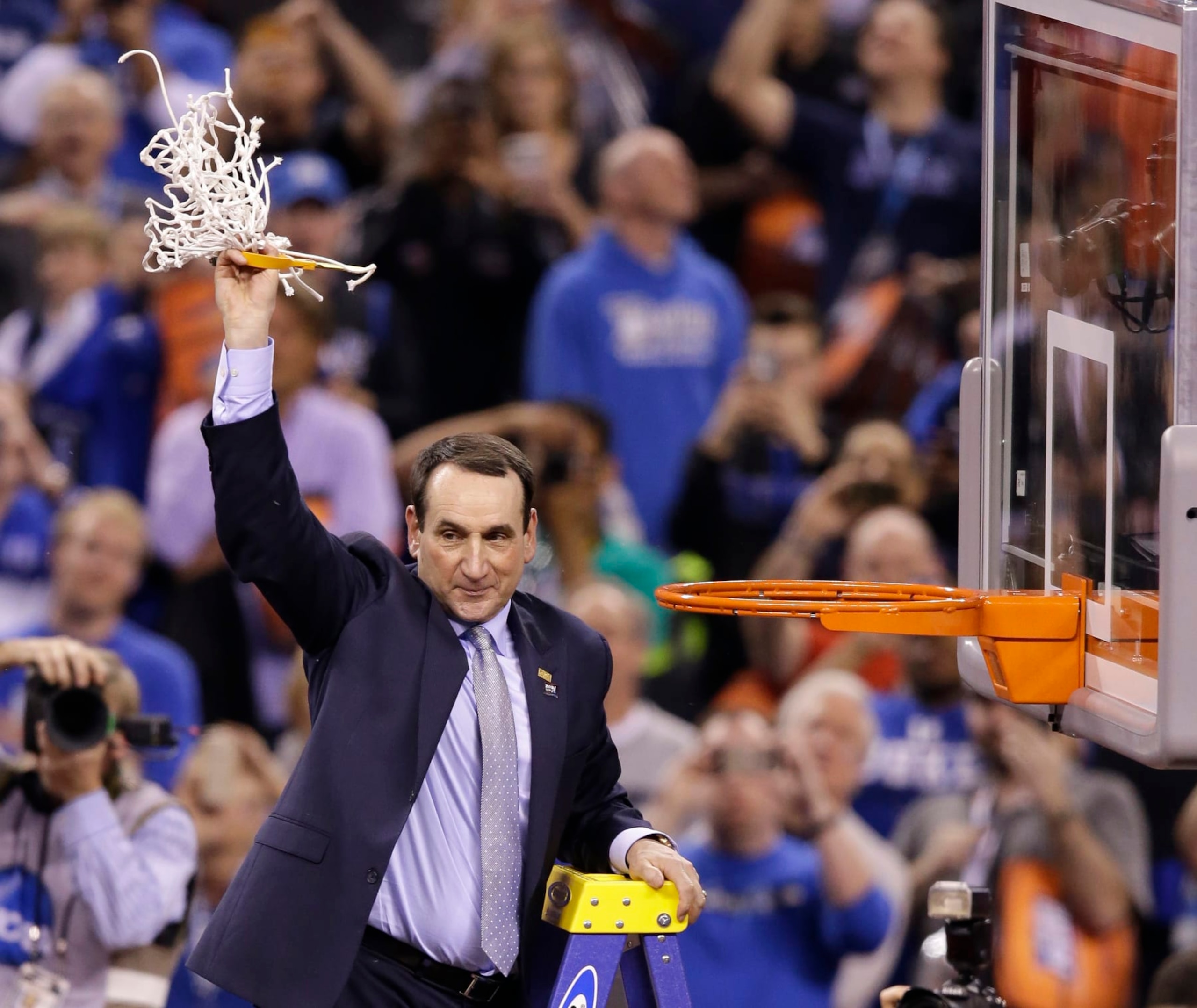 FILE - In this April 6, 2015, file photo, Duke head coach Mike Krzyzewski cuts down the net after his team's 68-63 victory over Wisconsin in the NCAA Final Four college basketball tournament championship game in Indianapolis. The parallels between this Duke team and the group from 2014-15 seem too obvious to ignore: A roster dominated by one-and-done freshmen led those Blue Devils to their fifth national title, and now a repeat of that year certainly appears possible _ maybe even likely. (AP Photo/Darron Cummings, File)