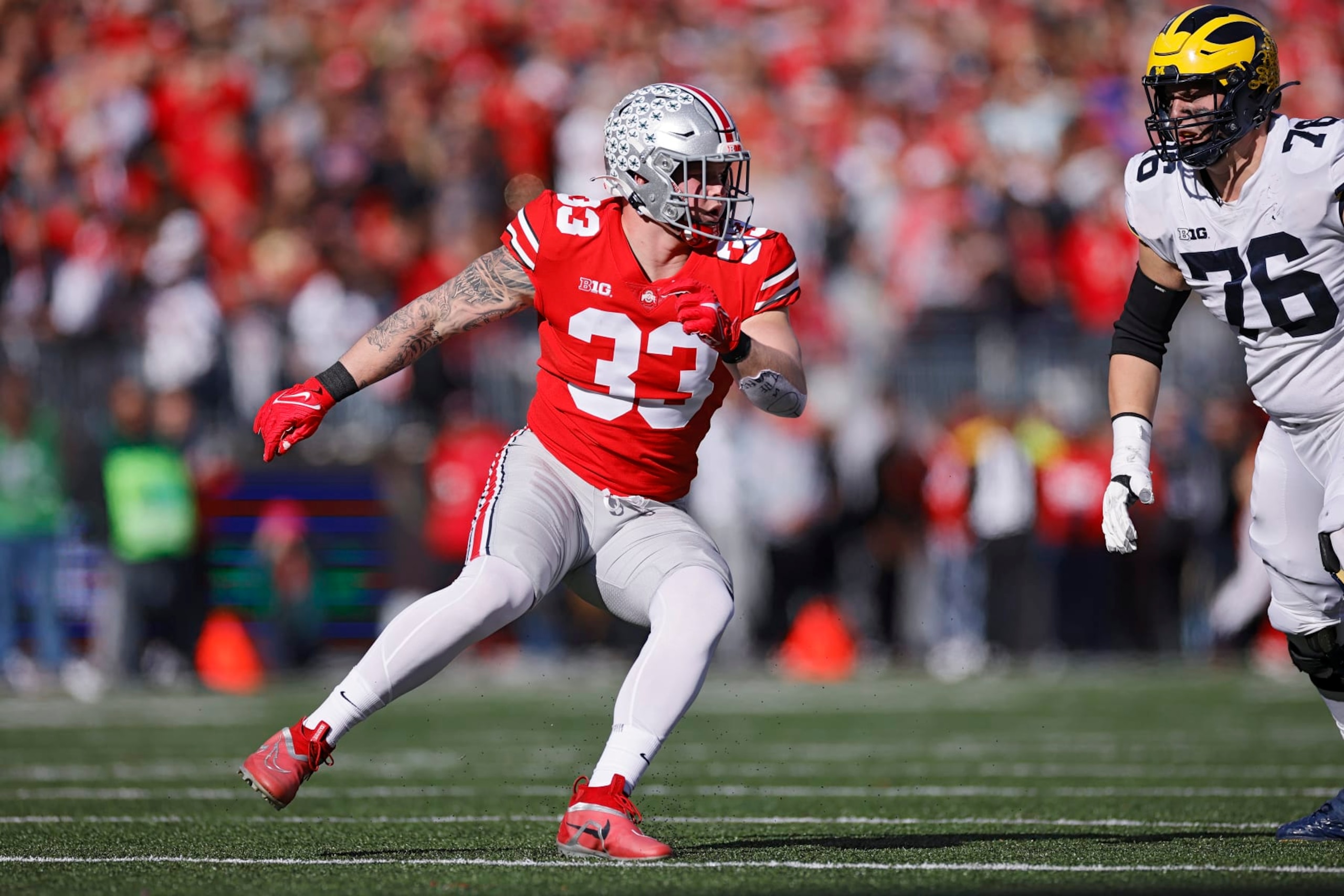 COLUMBUS, OH - NOVEMBER 26: Ohio State Buckeyes defensive end Jack Sawyer (33) rushes on defense during a college football game against the Michigan Wolverines on November 26, 2022 at Ohio Stadium in Columbus, Ohio. (Photo by Joe Robbins/Icon Sportswire via Getty Images) COLUMBUS, OH - NOVEMBER 26: Ohio State Buckeyes defensive end Jack Sawyer (33) rushes on defense during a college football game against the Michigan Wolverines on November 26, 2022 at Ohio Stadium in Columbus, Ohio. (Photo by Joe Robbins/Icon Sportswire via Getty Images)