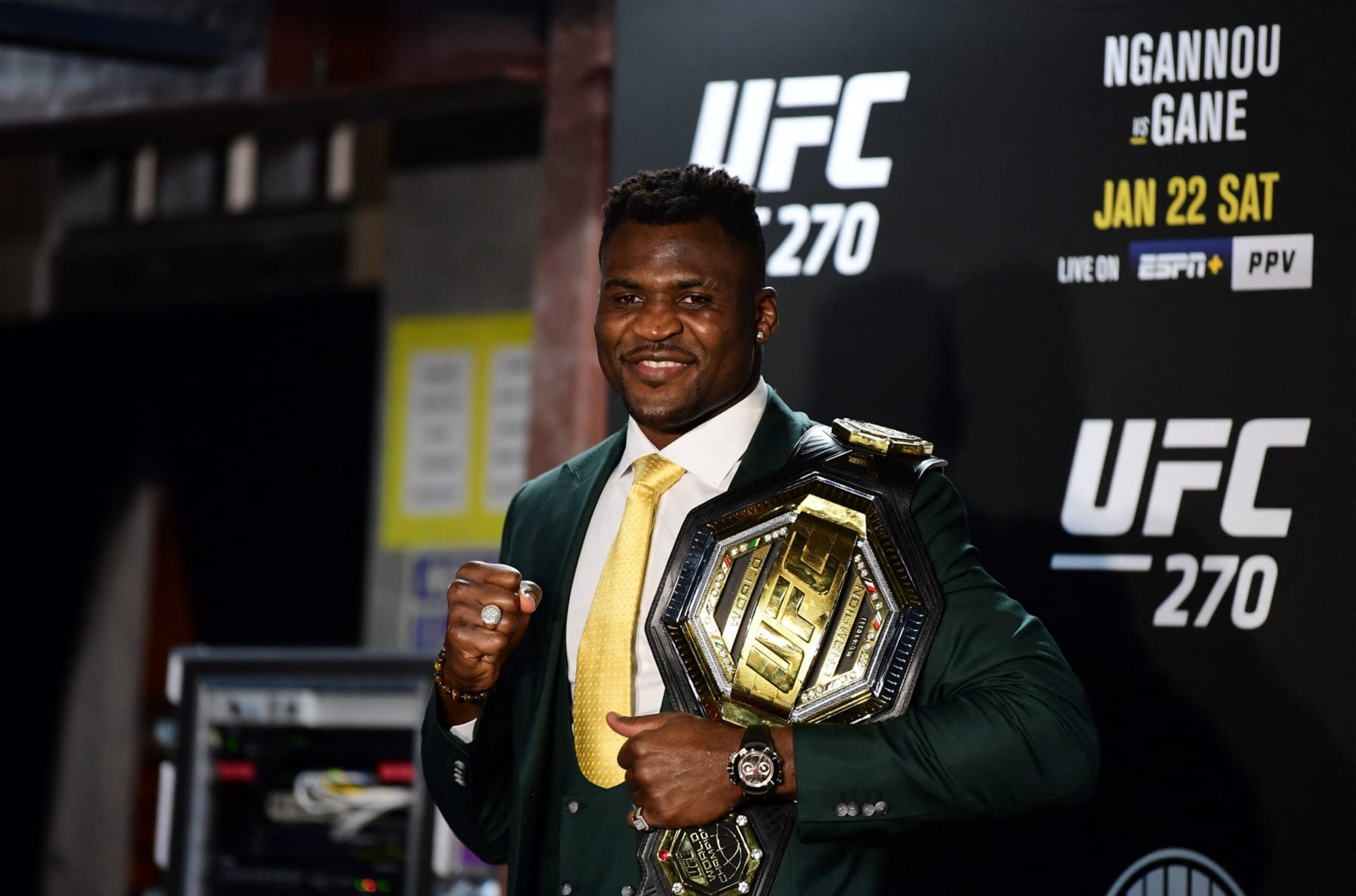 Champion Cameroon's Francis Ngannou holds the championship belt in the press room after defeating French Ciryl Gane in their UFC 270 championship fight in Anaheim on January 22, 2022. (Photo by Frederic J. BROWN / AFP) (Photo by FREDERIC J. BROWN/AFP via Getty Images)