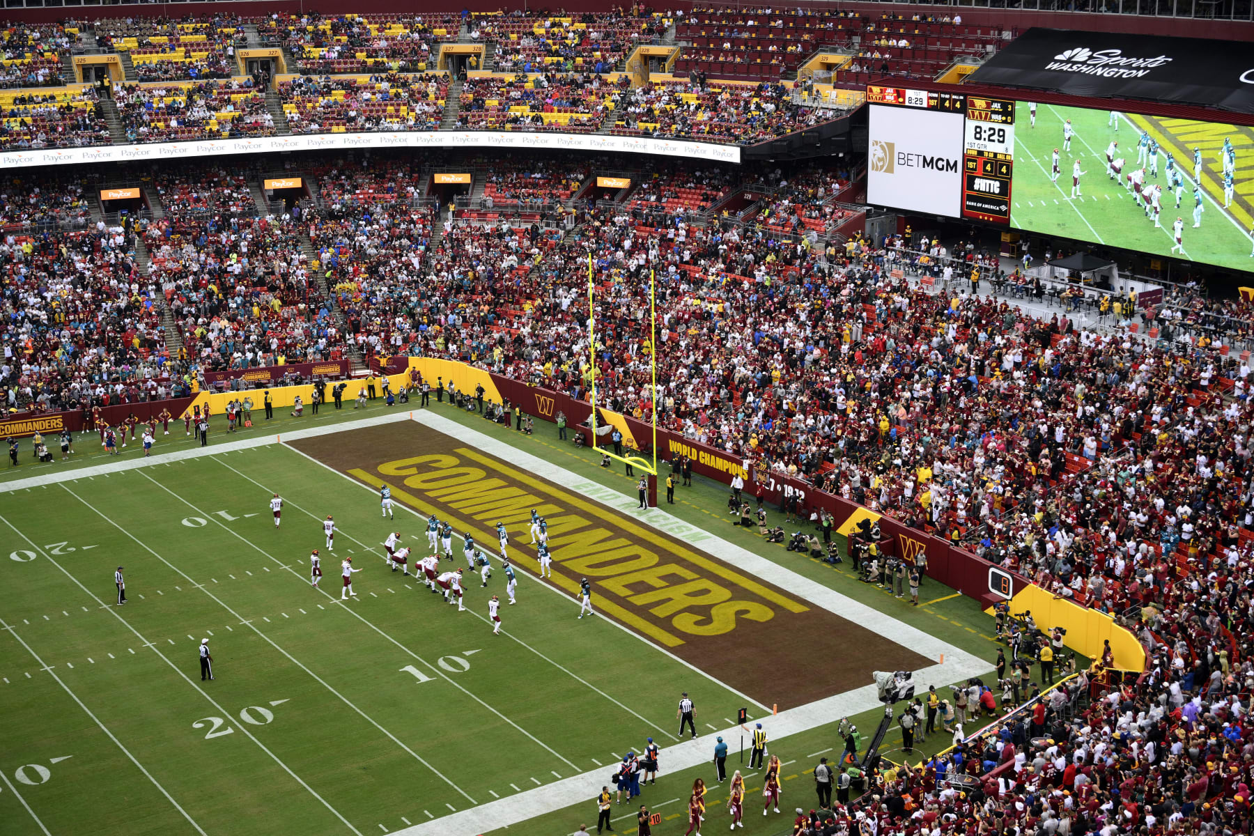 FILE - Fans watch as the Washington Commanders face the Jacksonville Jaguars in an NFL football game, Sunday, Sept. 11, 2022, in Landover, Md. The Washington Commanders have settled a suit with the District of Columbia’s attorney general’s office over fans’ season-ticket deposit money. Attorney general Brian L. Schwalb on Monday, April 10, 2023, announced the agreement that returns $200,000 to fans and pay $425,000 to the District to resolve allegations related to the deposits. Predecessor Karl A. Racine filed the consumer protection suit late last year. (AP Photo/Nick Wass, File)