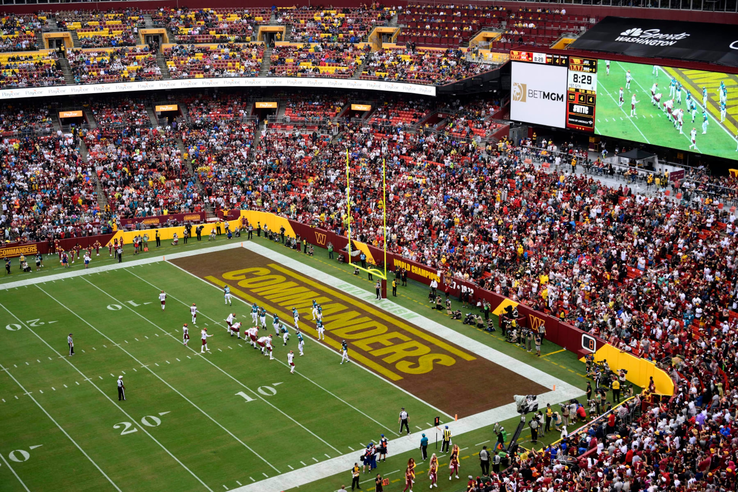 FILE - Fans watch as the Washington Commanders face the Jacksonville Jaguars in an NFL football game, Sunday, Sept. 11, 2022, in Landover, Md. The Washington Commanders have settled a suit with the District of Columbia’s attorney general’s office over fans’ season-ticket deposit money. Attorney general Brian L. Schwalb on Monday, April 10, 2023, announced the agreement that returns $200,000 to fans and pay $425,000 to the District to resolve allegations related to the deposits. Predecessor Karl A. Racine filed the consumer protection suit late last year. (AP Photo/Nick Wass, File)